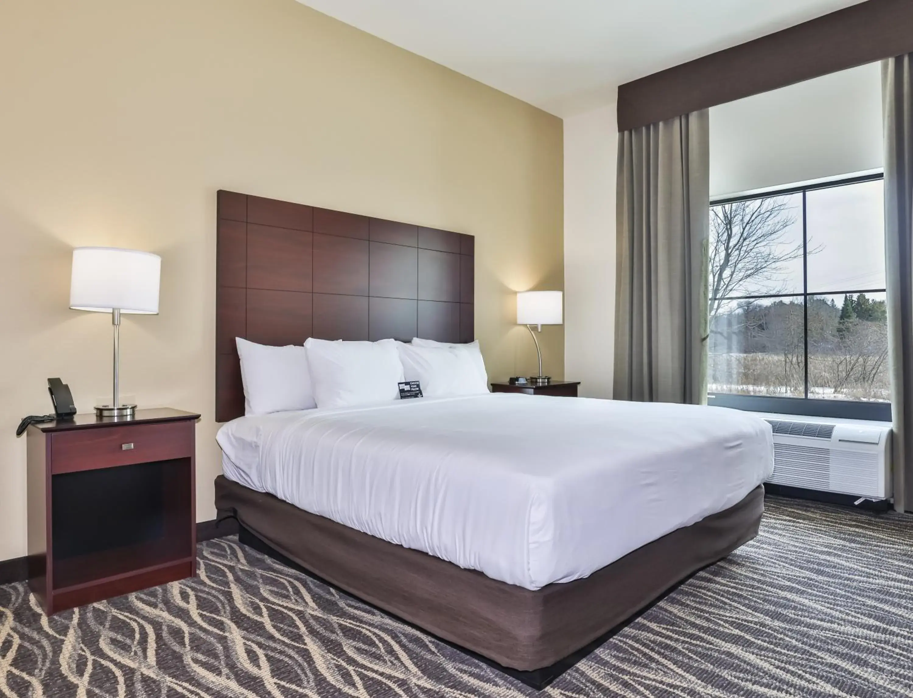 Bed in Cobblestone Hotel & Suites - Rhinelander Bed in Cobblestone Hotel & Suites - Rhinelander