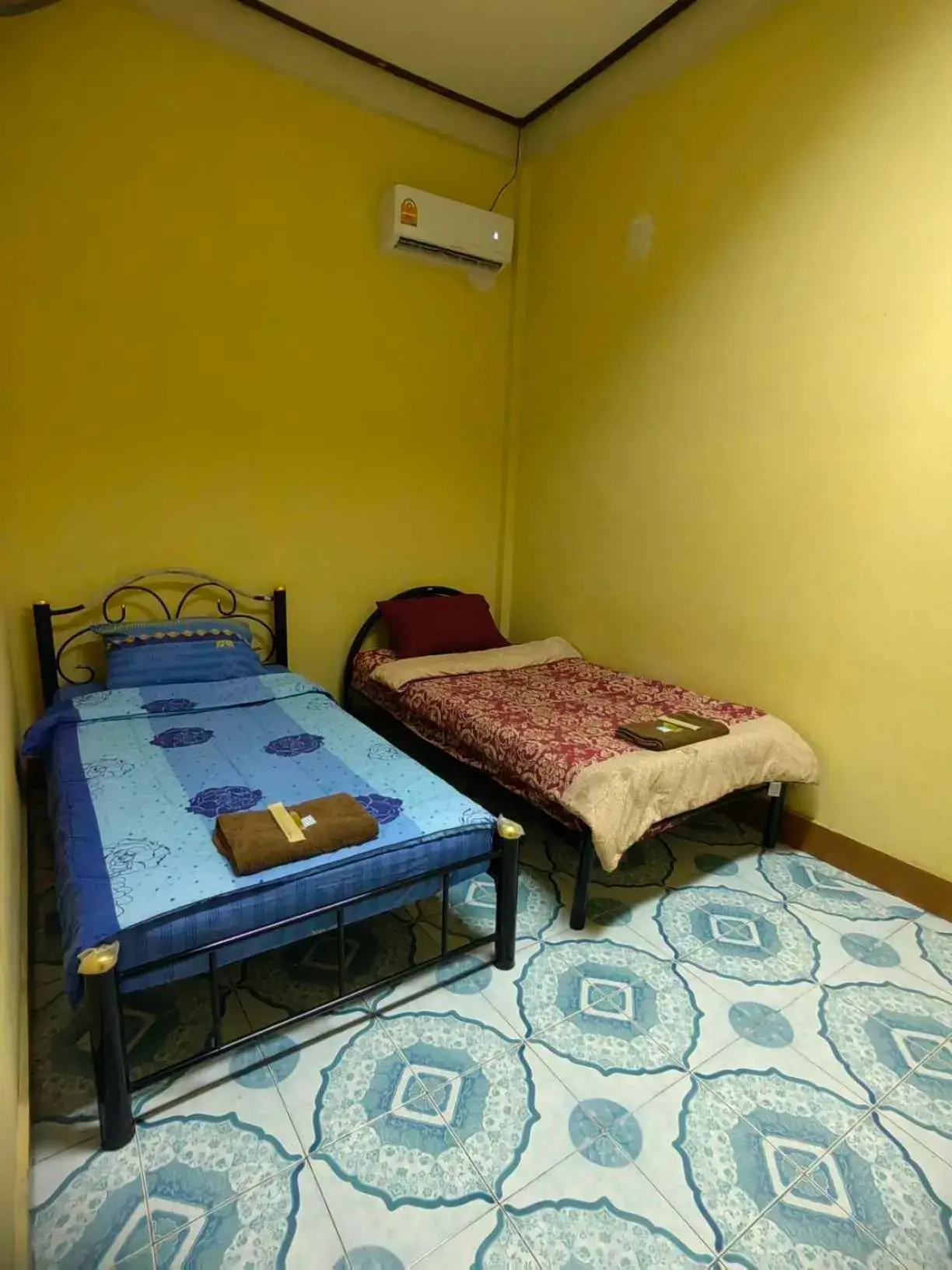 Bed in Mabuhay Guest House, Thai Embassy Vientiane Bed in Mabuhay Guest House, Thai Embassy Vientiane