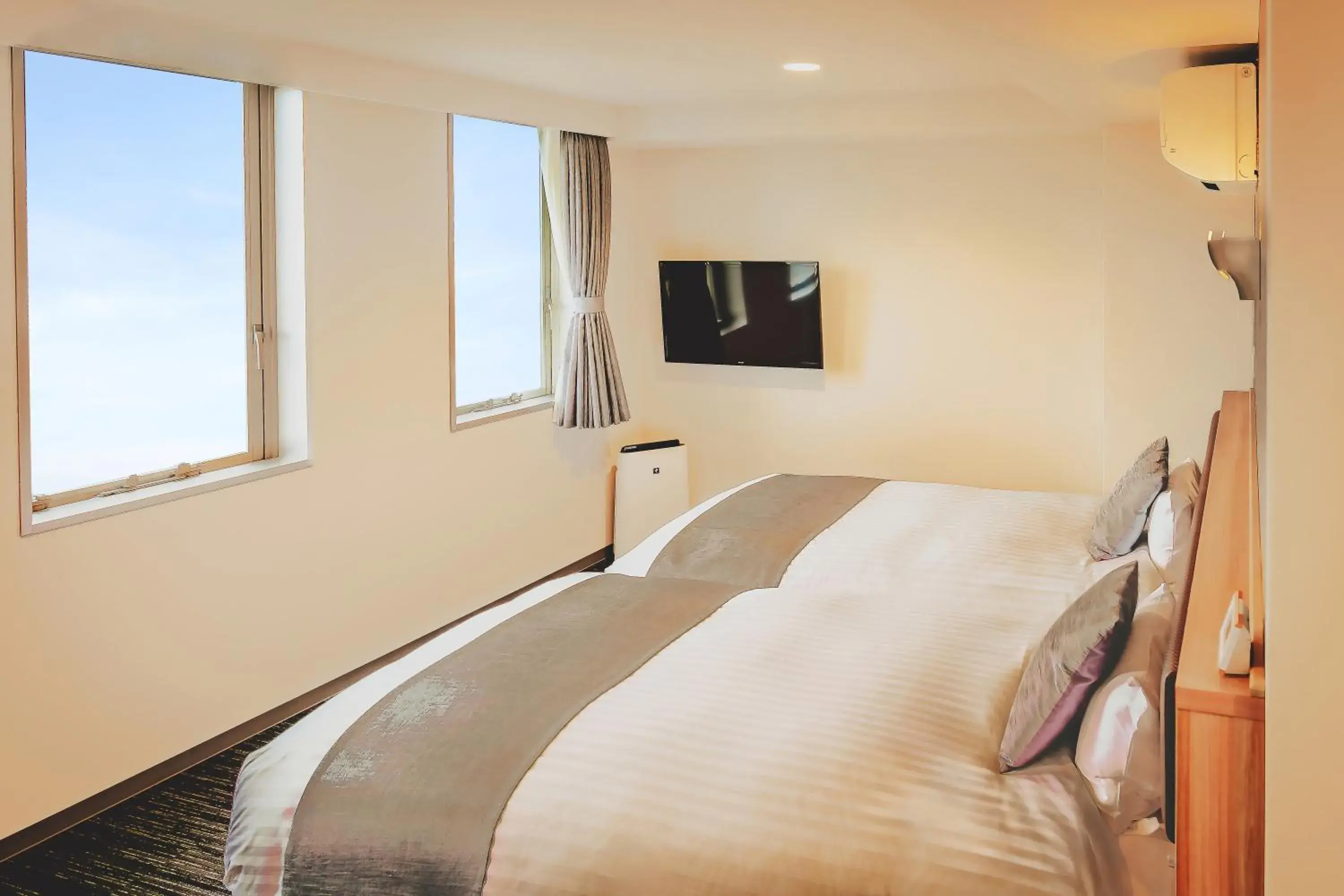 Bed in AIRAIKUHOTEL kagoshima Bed in AIRAIKUHOTEL kagoshima