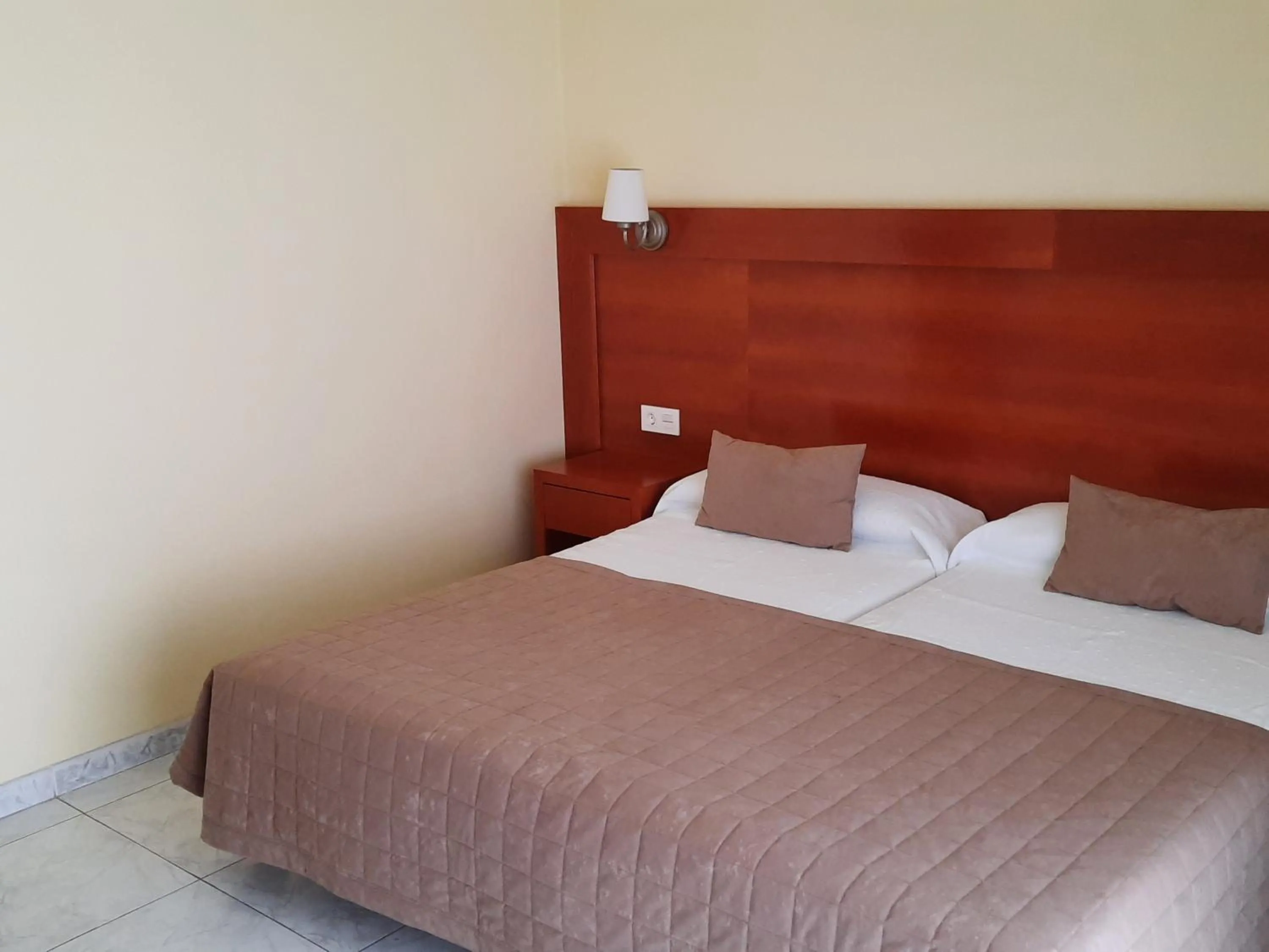 Bed in Hotel Cervantes