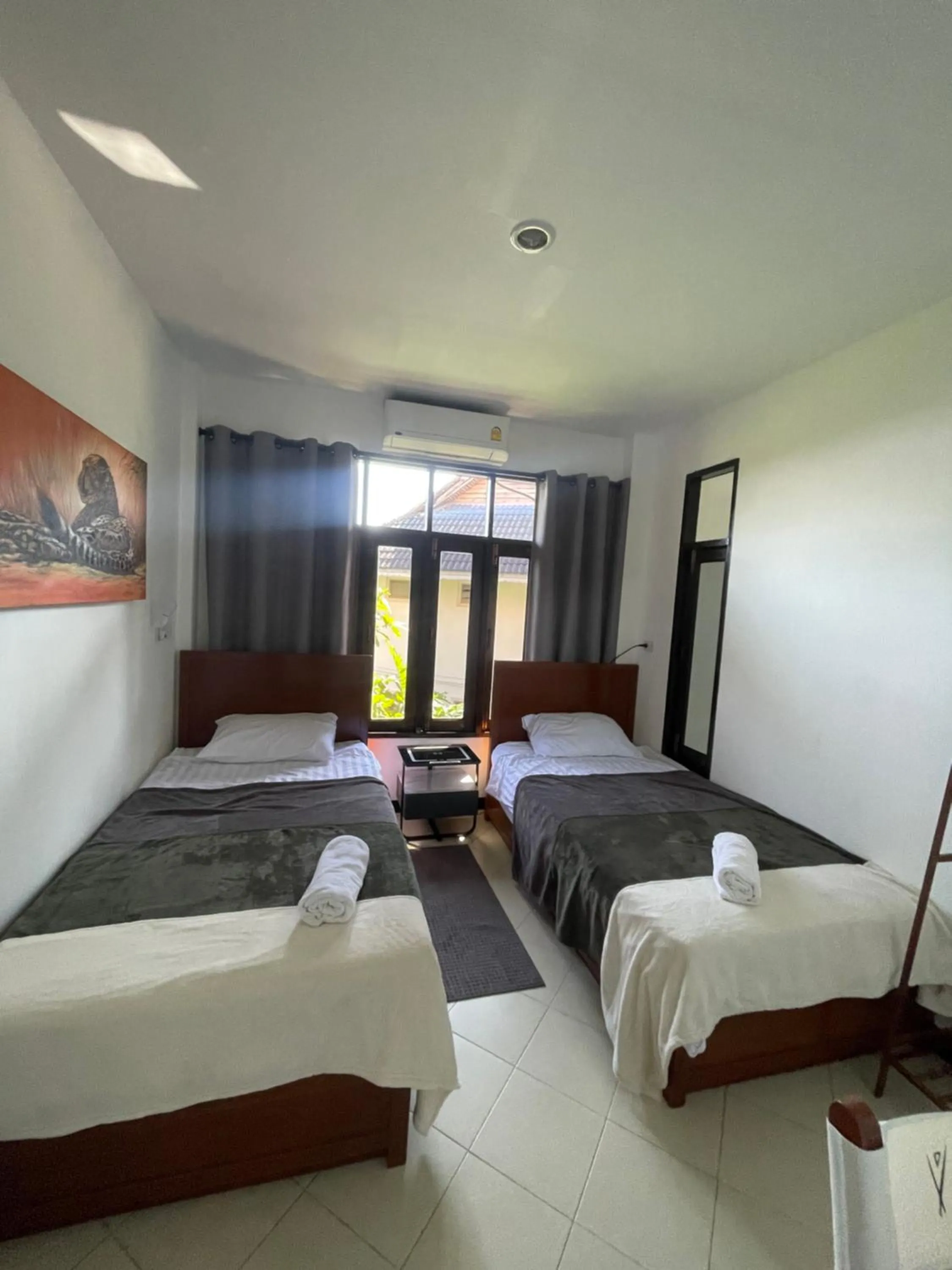 Bed in Aisawan Resort villa