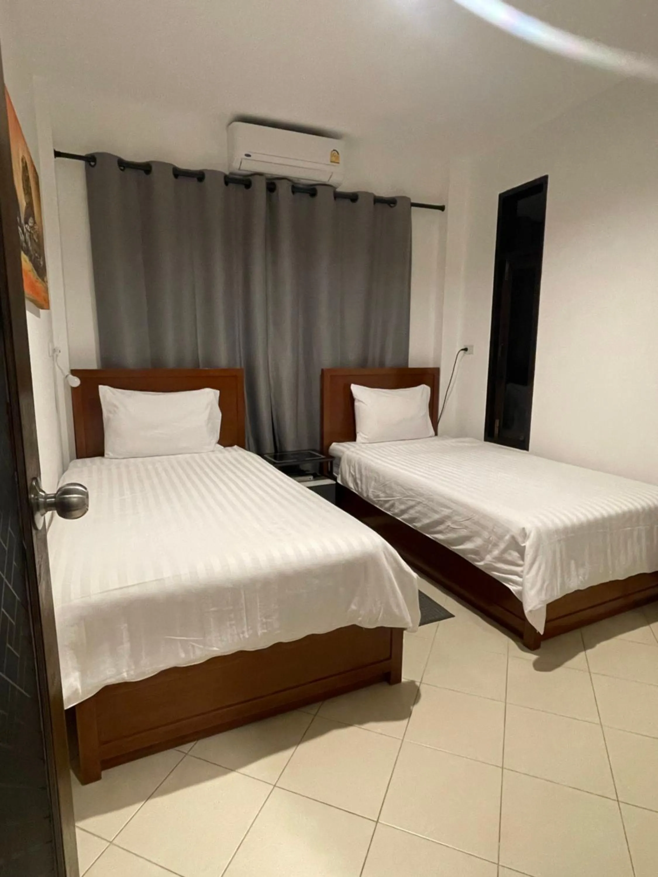 Bed in Aisawan Resort villa