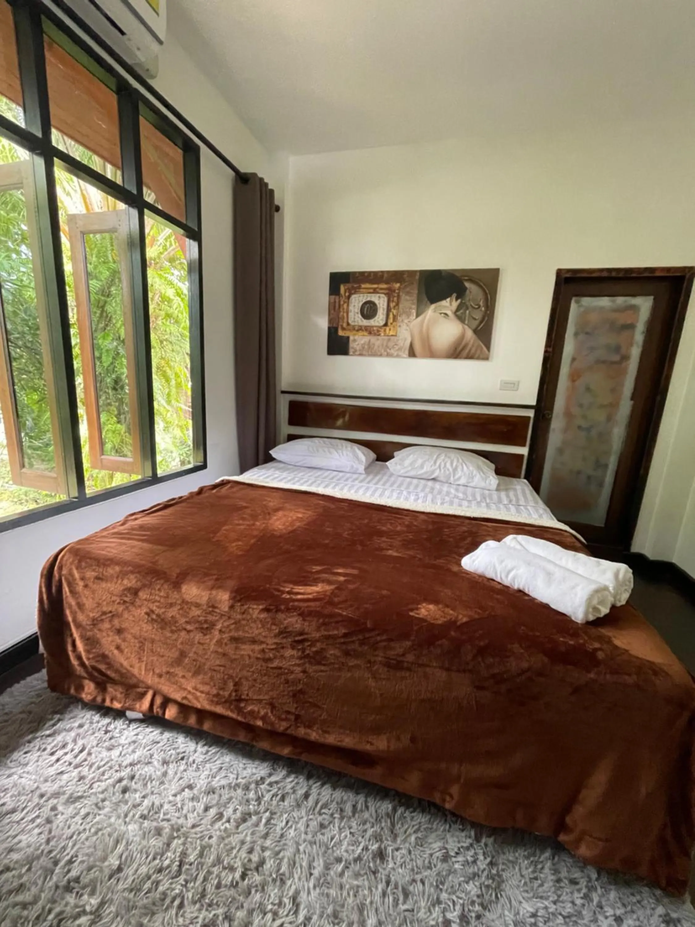 Bed in Aisawan Resort villa