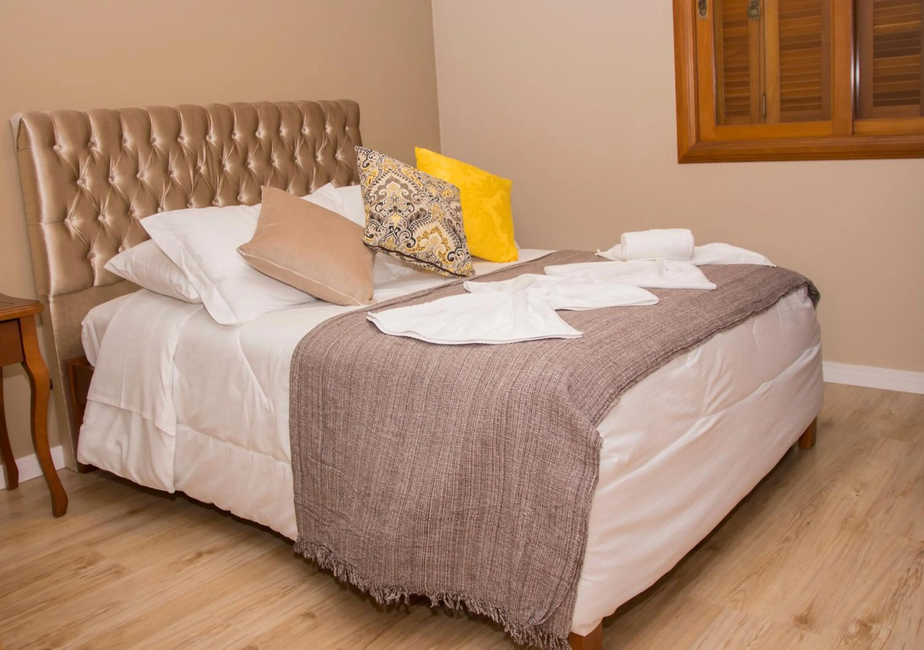 Bed in Pousada Caminho dos Plátanos