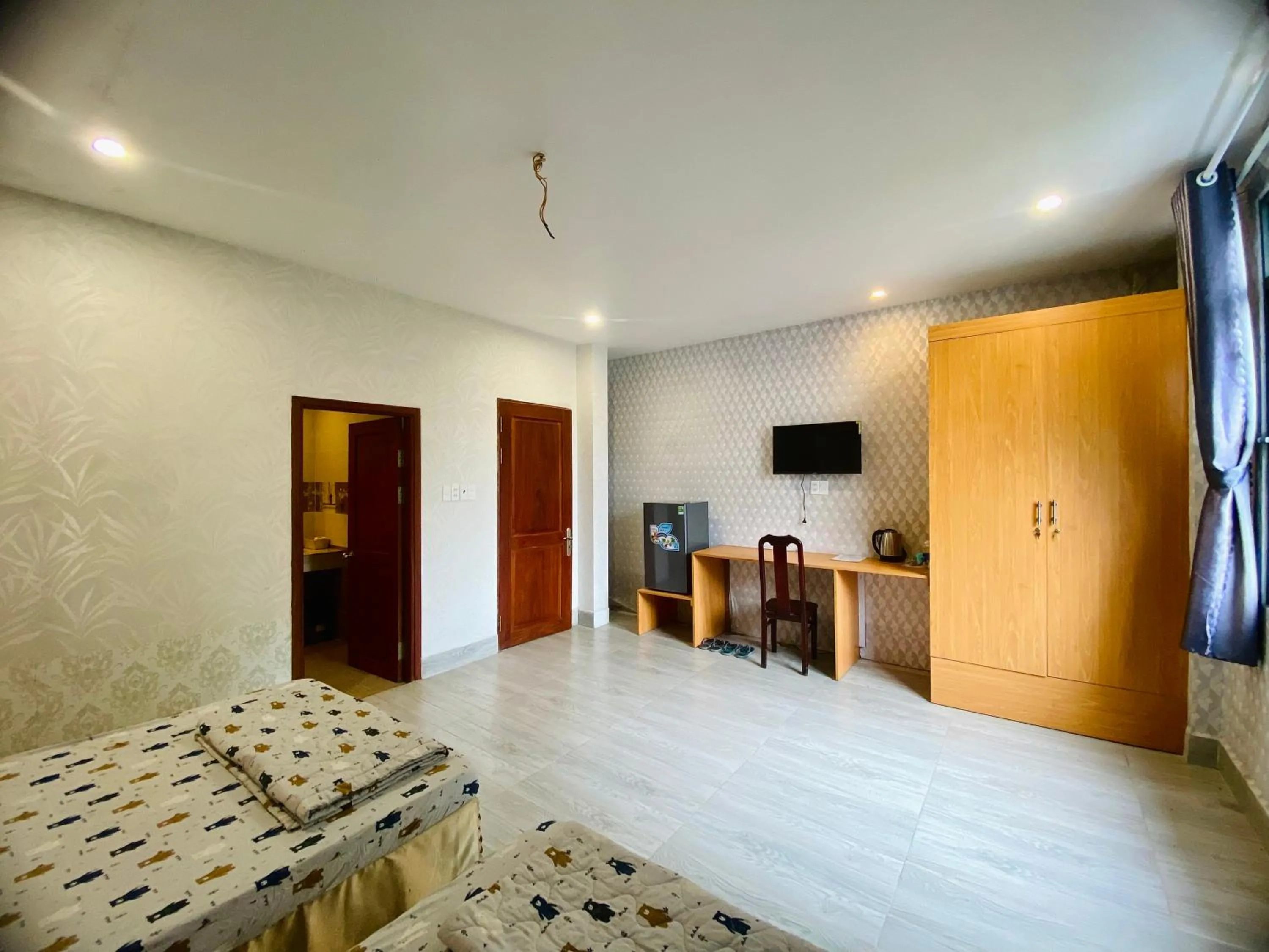 Communal lounge/ TV room, Bed in Sunny 1 Hometel Vinh Long