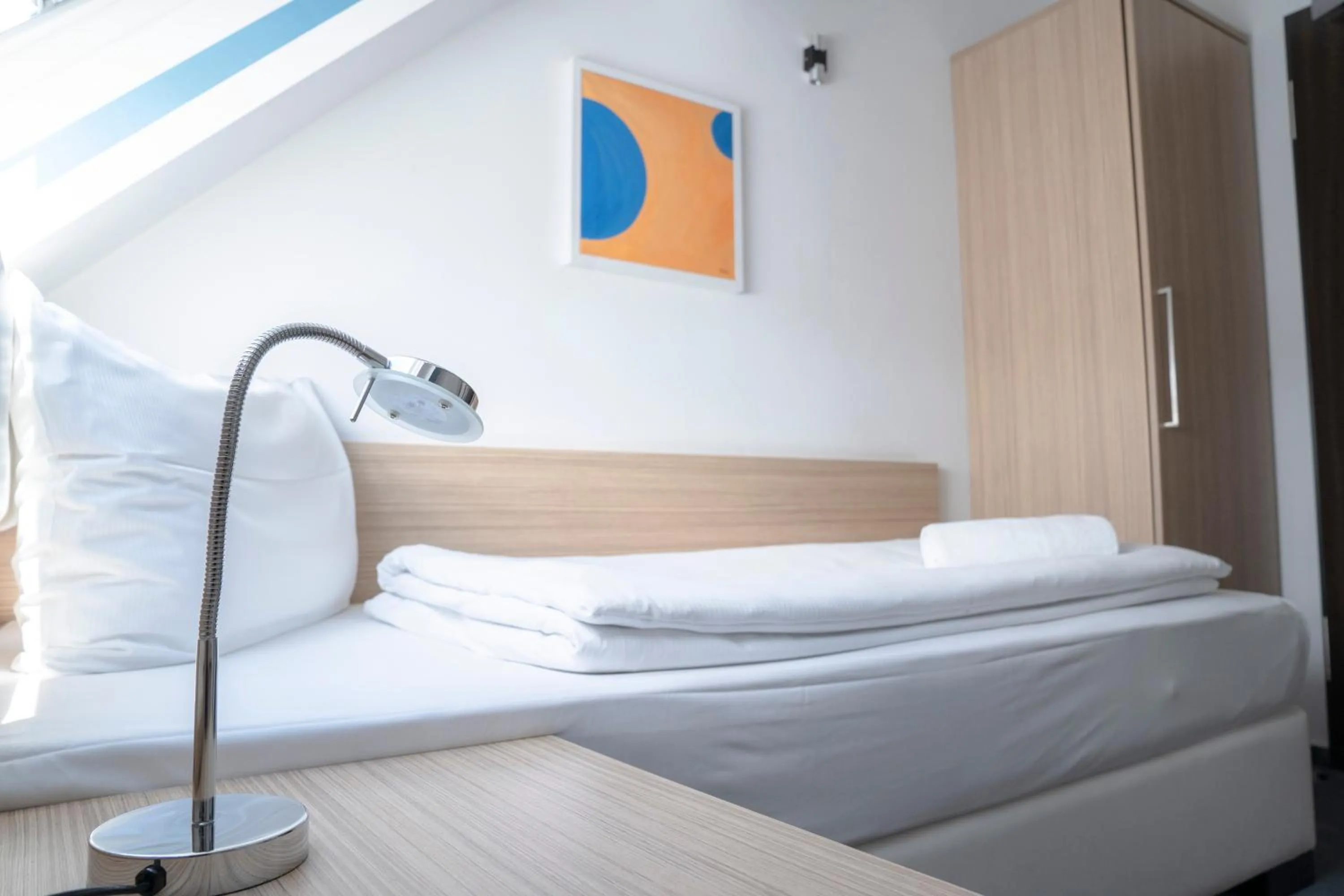 Bed in Alpha & Omega Hotel Stuttgart