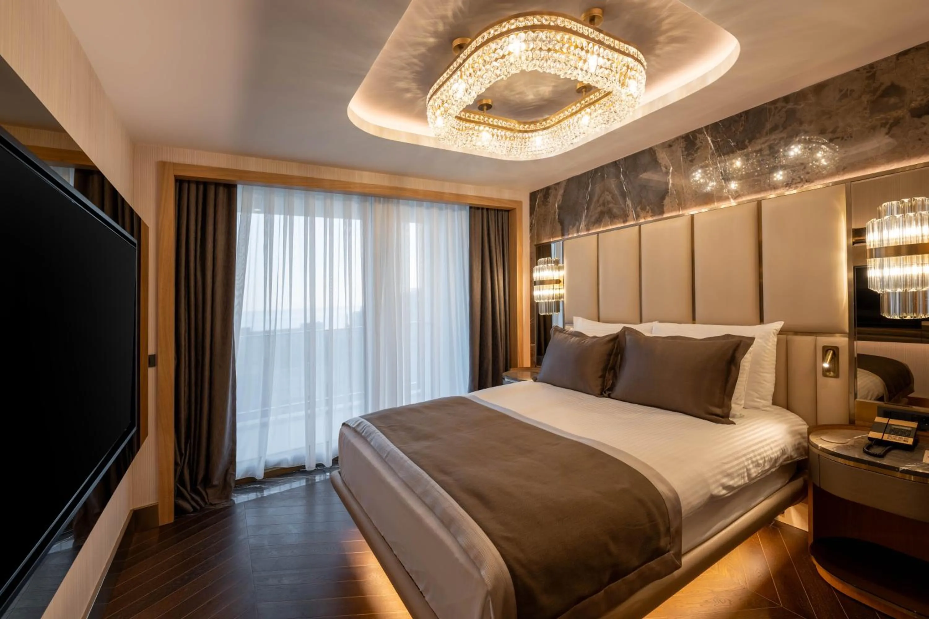 Bed in Merit Starlit Hotel & Residences