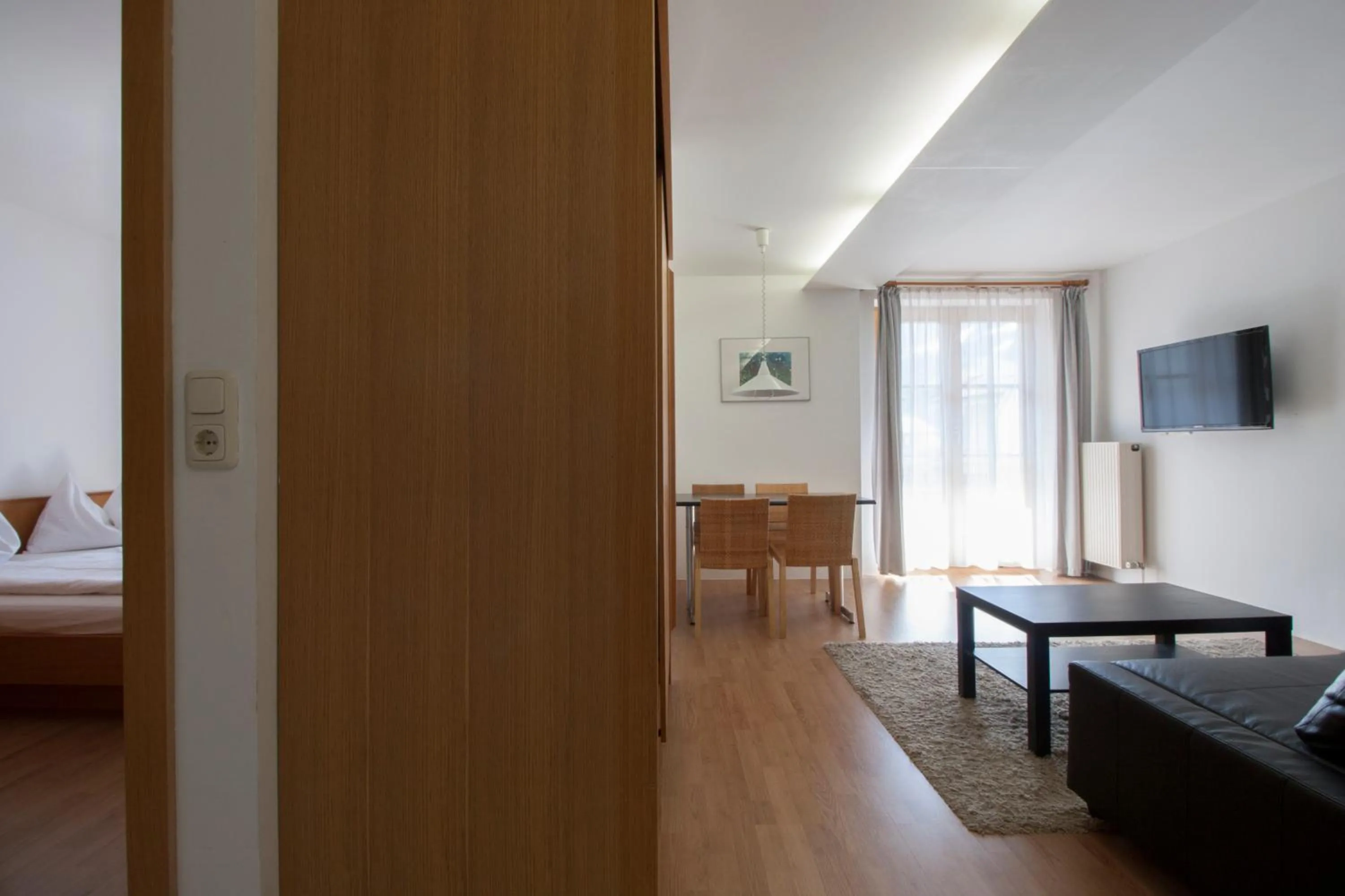 Living room, Bed in Appartements Christophorus