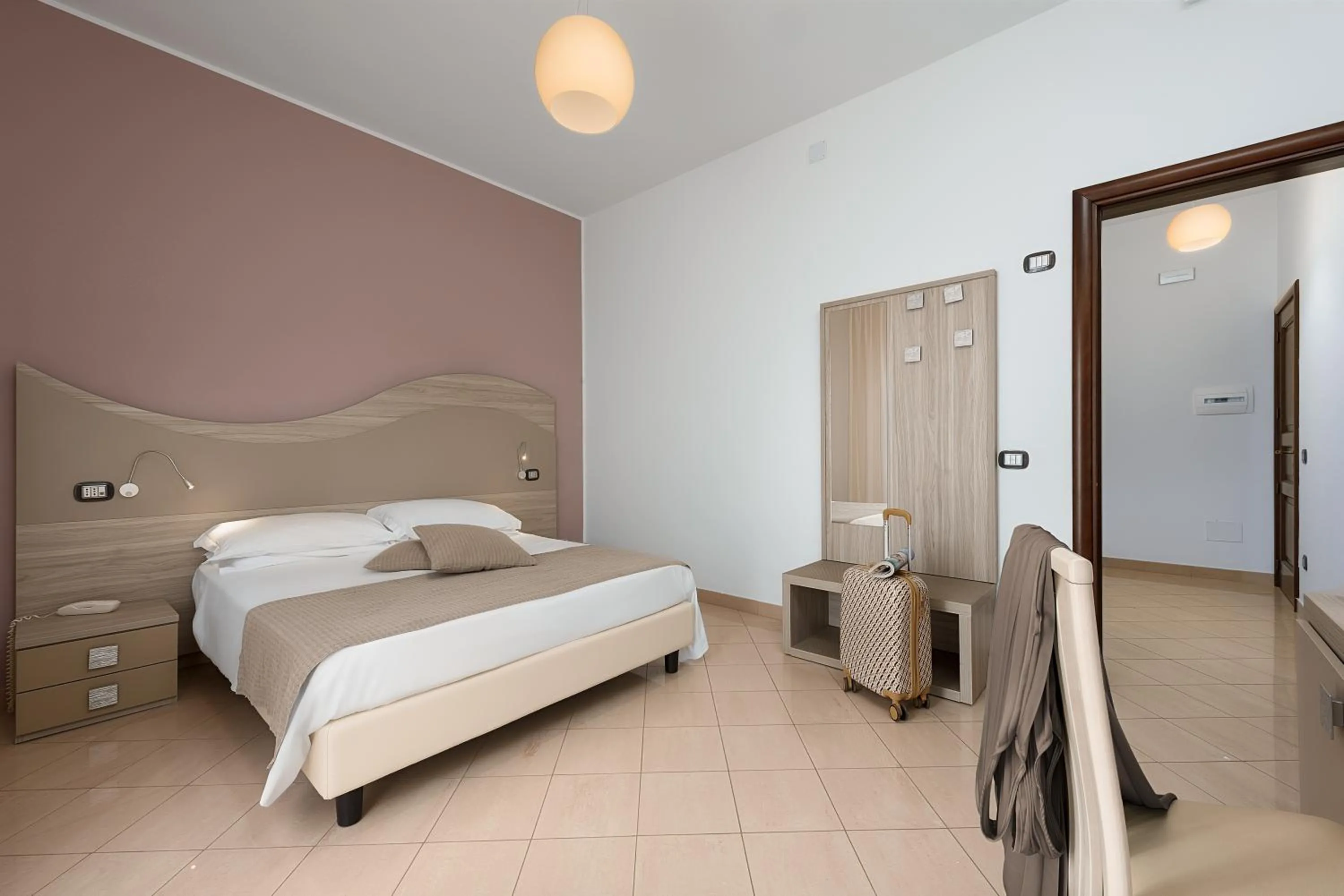 Bed in La Conchiglia sul mare Hotel