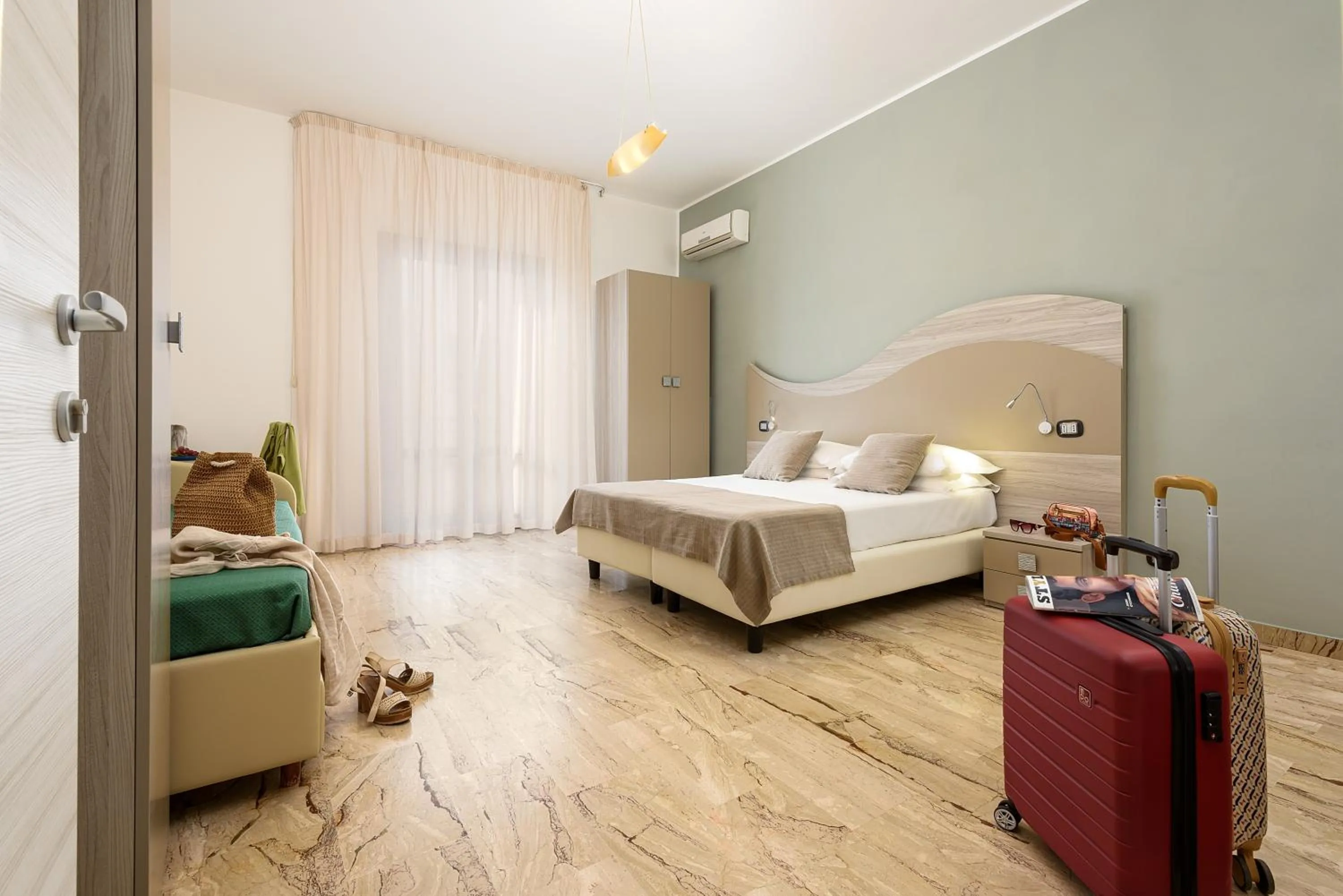 Bed in La Conchiglia sul mare Hotel