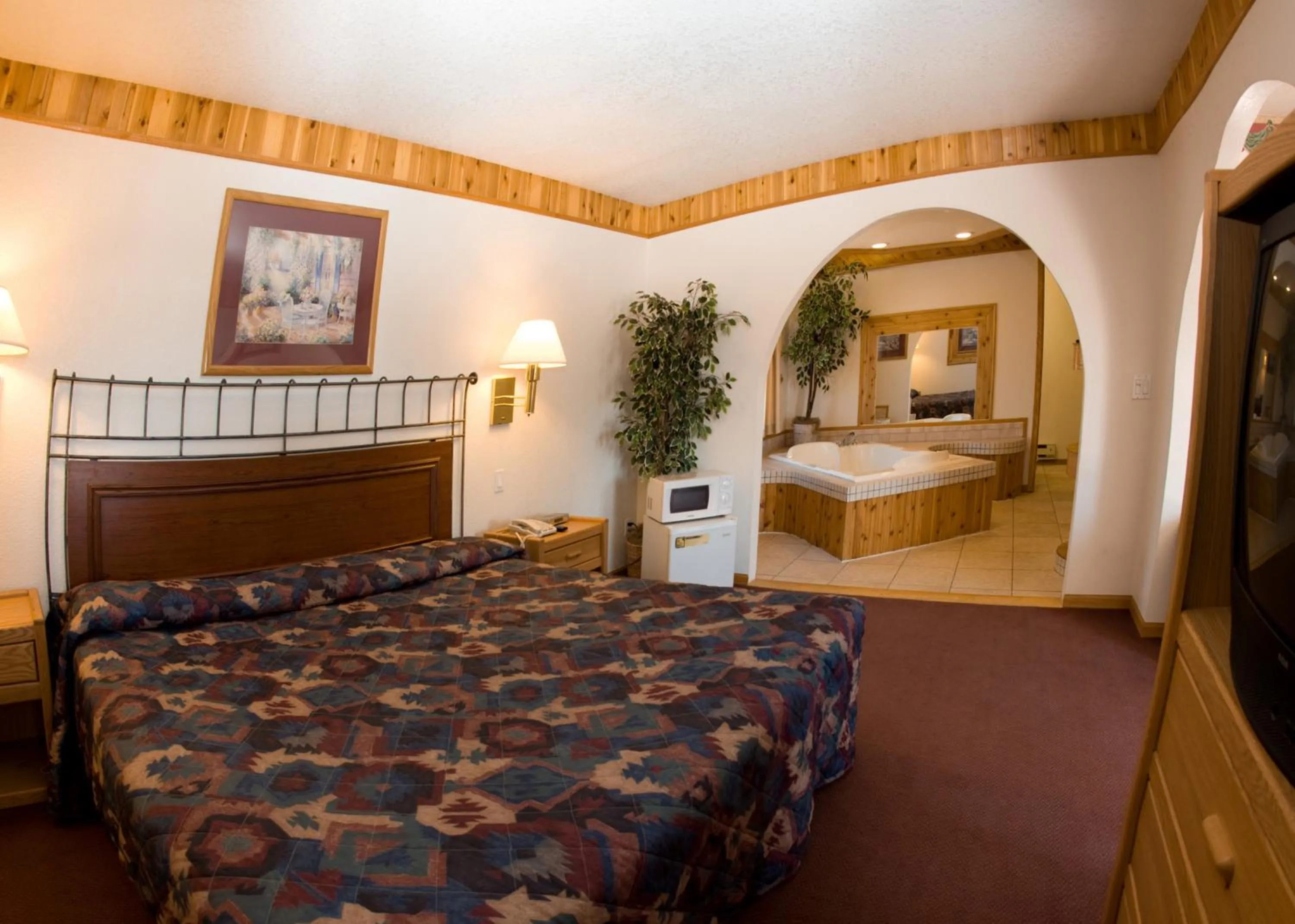Bed in North Country Inn & Suites