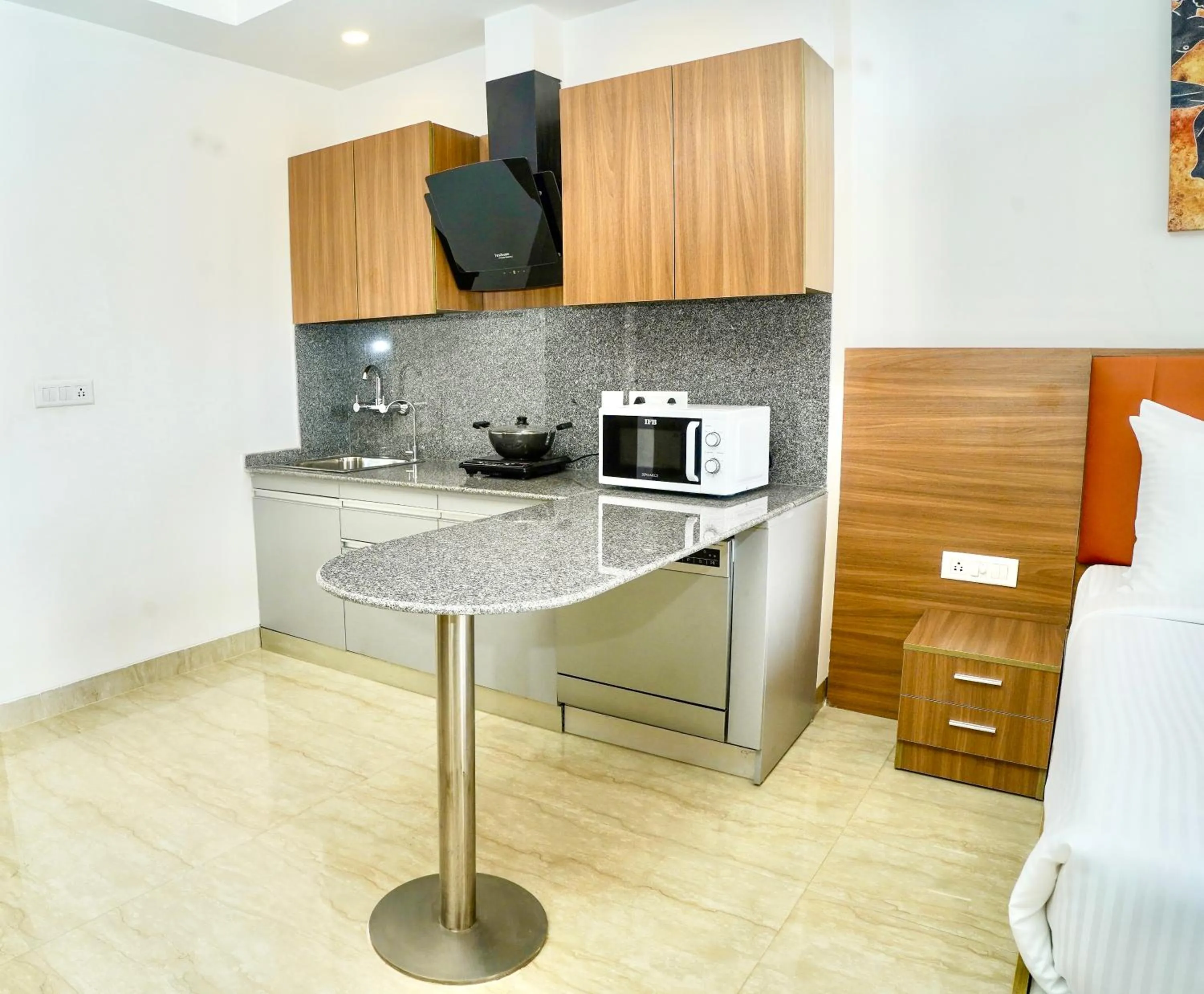 Kitchen or kitchenette in Alivaa Hotel Gurugram Sohna Road City Center