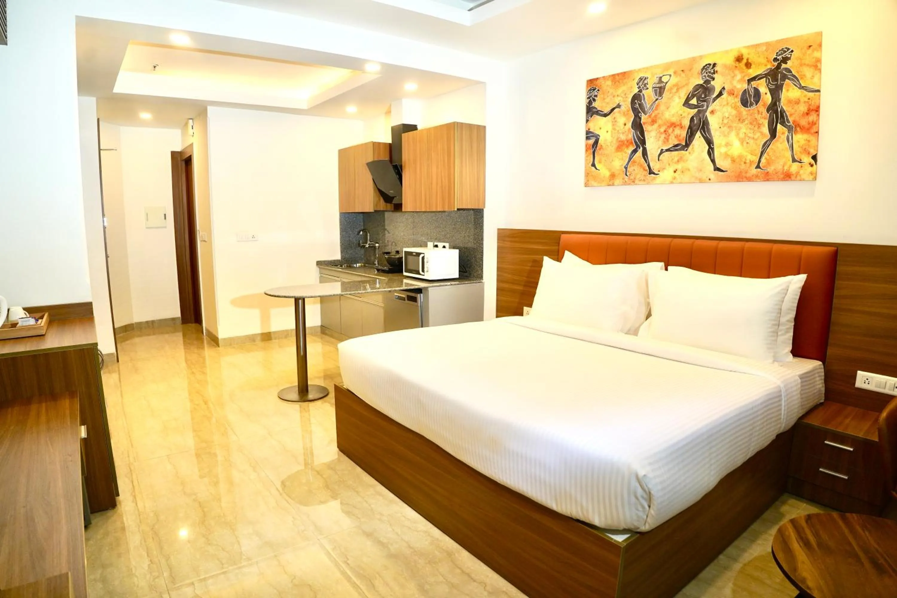 Kitchen or kitchenette, Bed in Alivaa Hotel Gurugram Sohna Road City Center