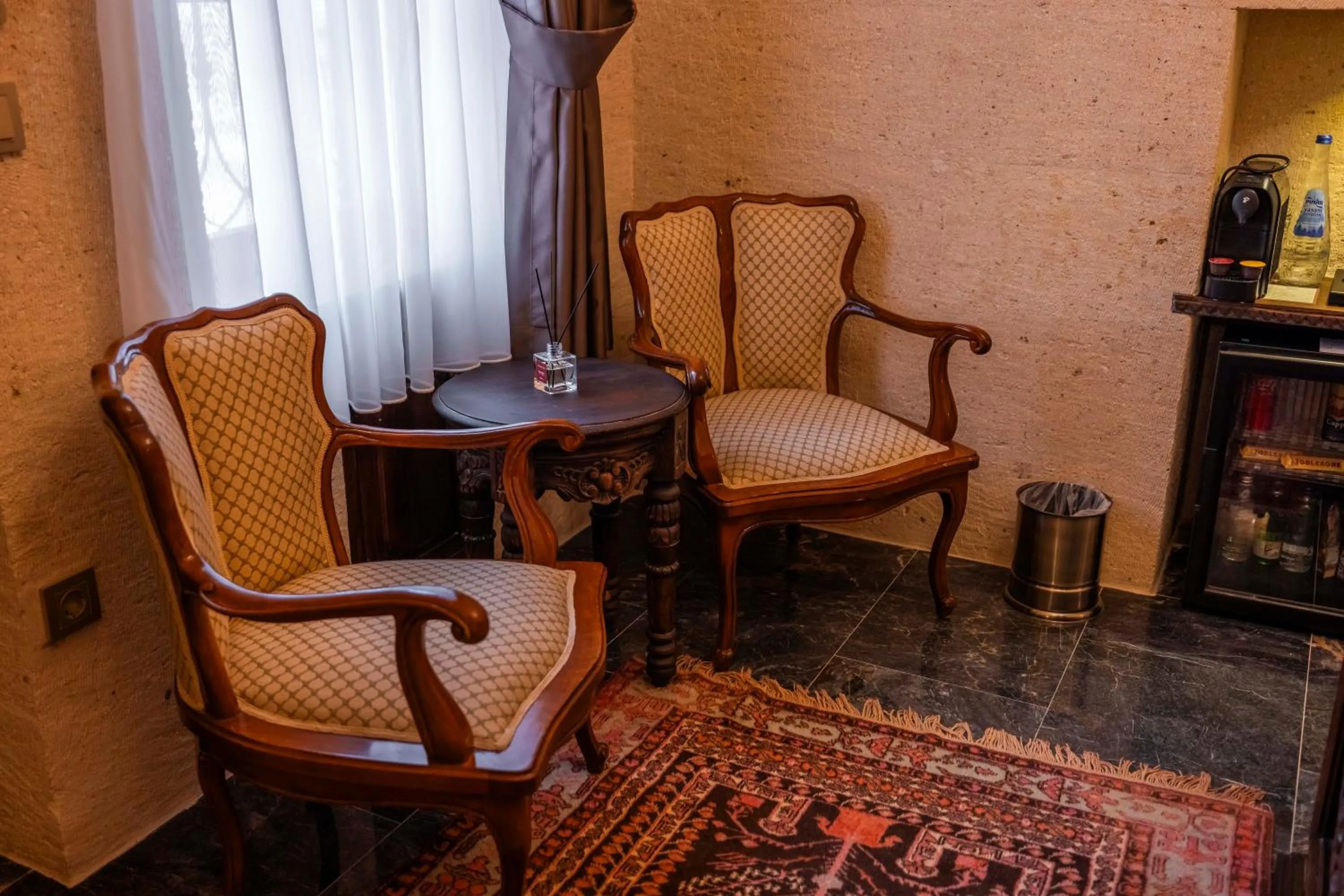 Seating area in Signature Cave Cappadocia, Trademark Collection by Wyndham