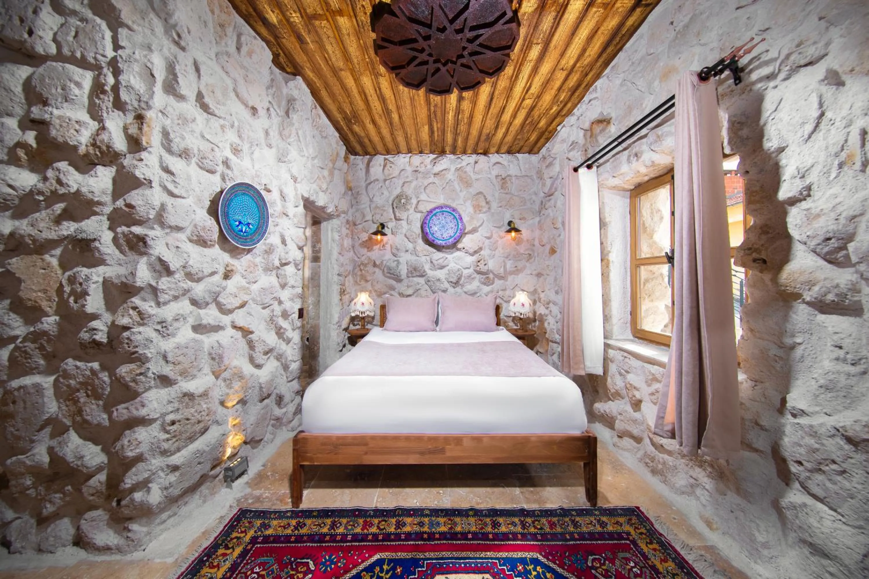 Bed in Cappadocia Cavusin Stone House