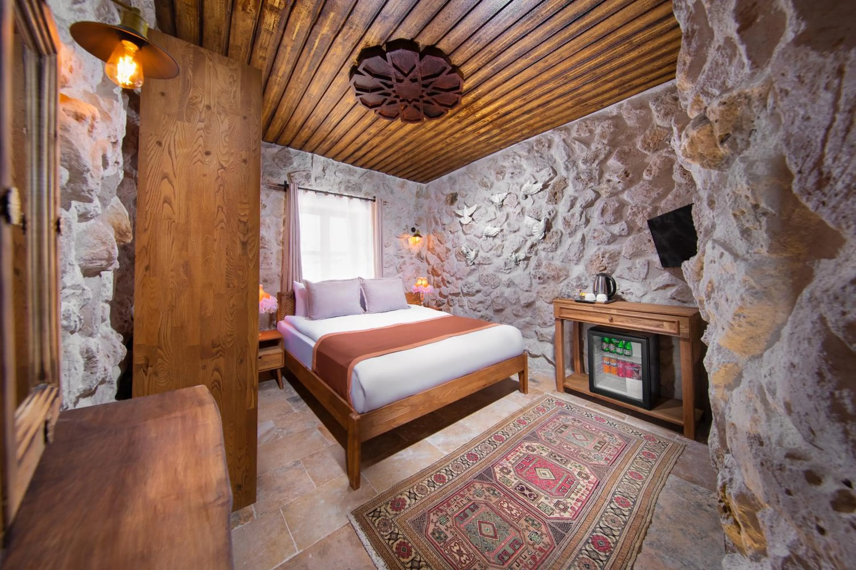 Photo of the whole room, Bed in Cappadocia Cavusin Stone House