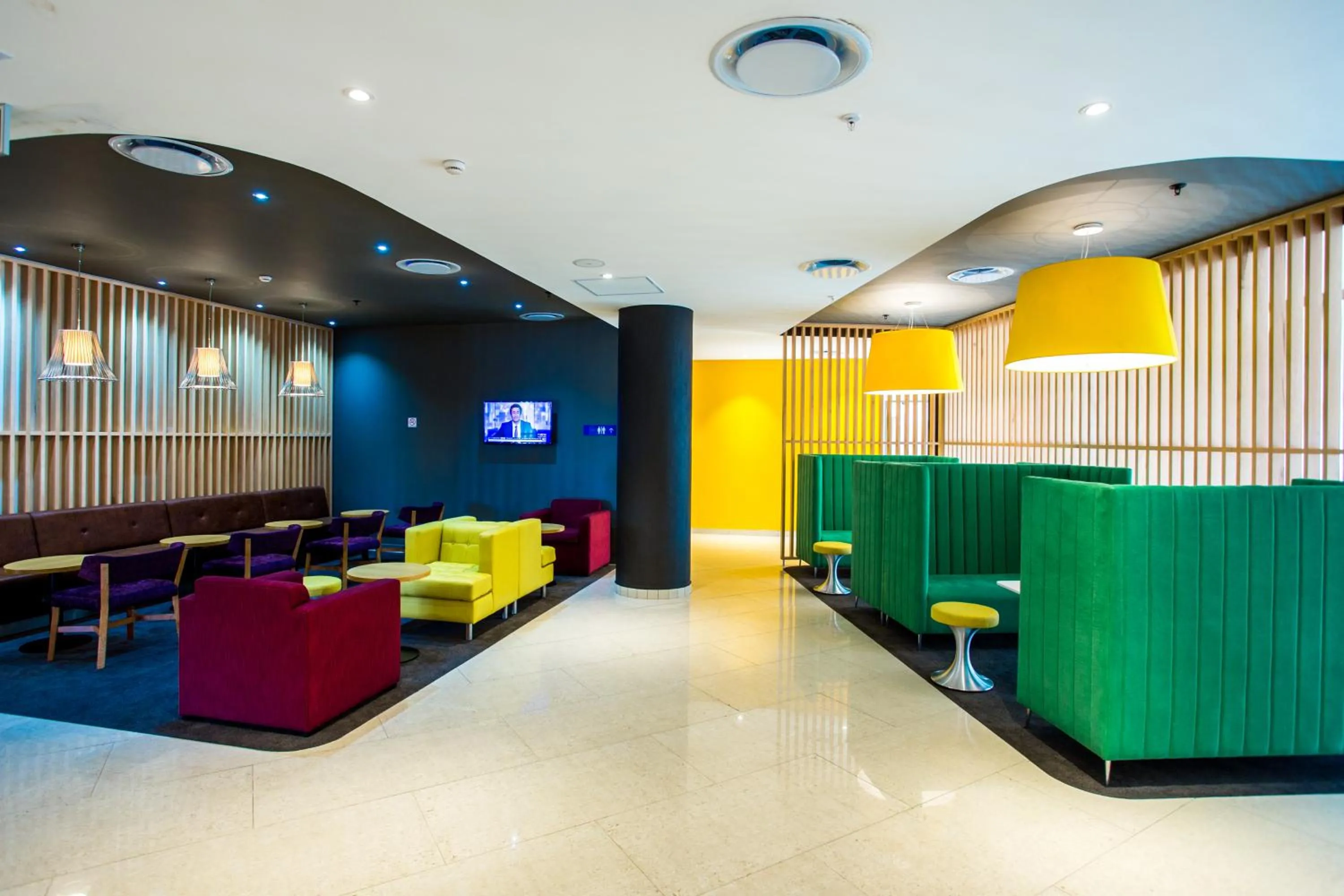 Communal lounge/ TV room in Park Inn by Radisson Libreville