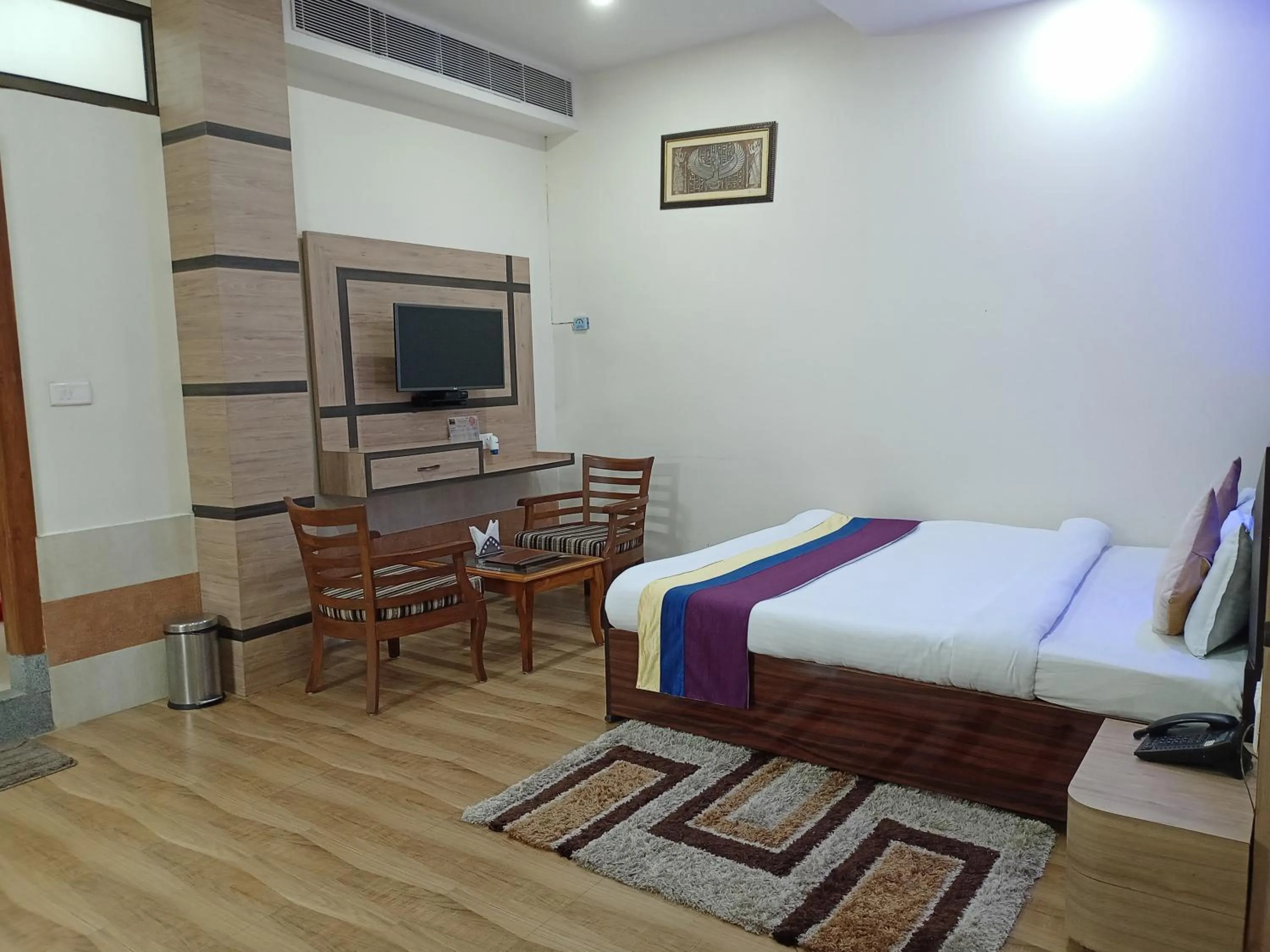 Communal lounge/ TV room, Bed in Dichang Resorts