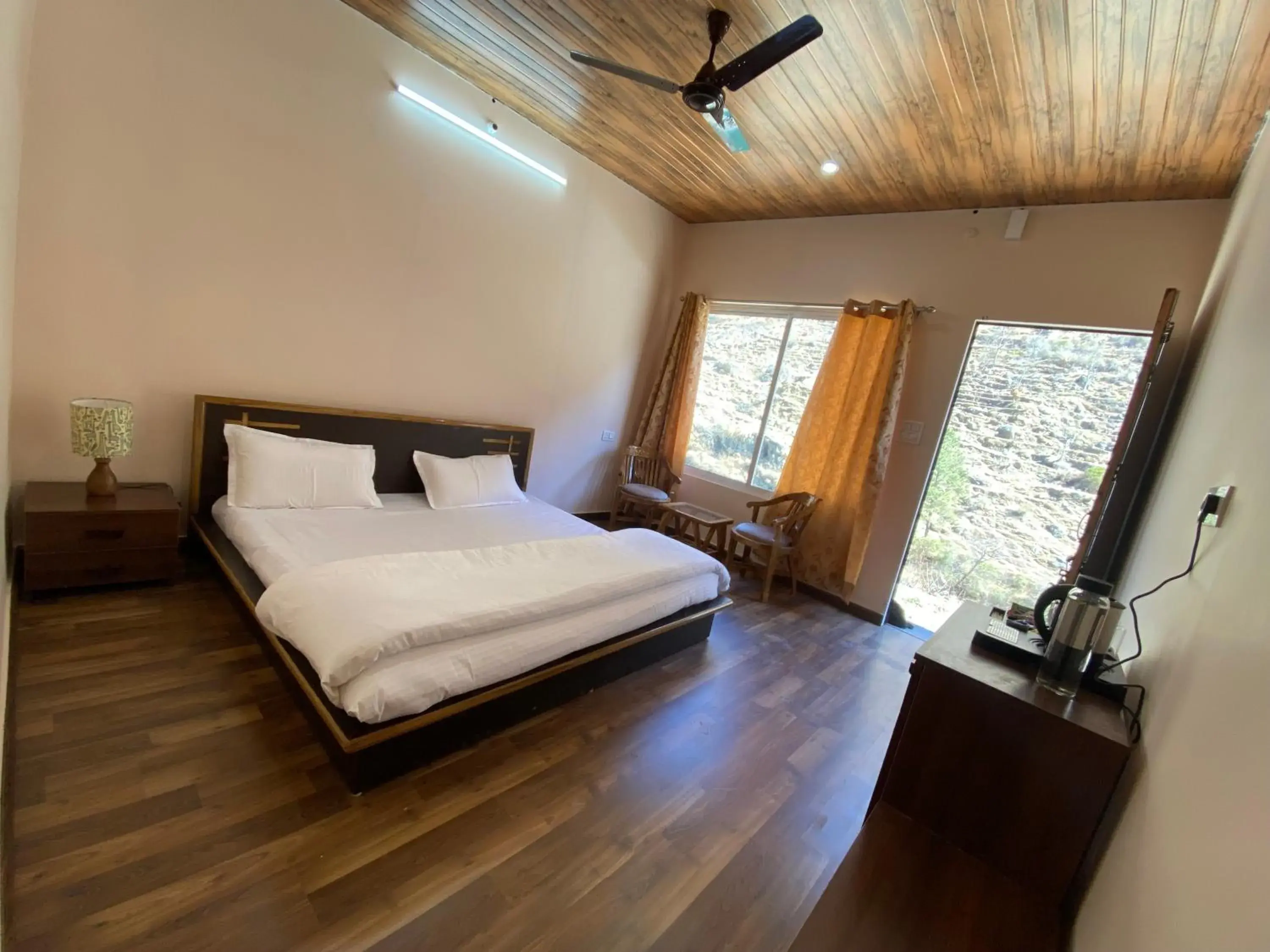 Bed in Bhagirathi Resort by Aikyam Bed in Bhagirathi Resort by Aikyam