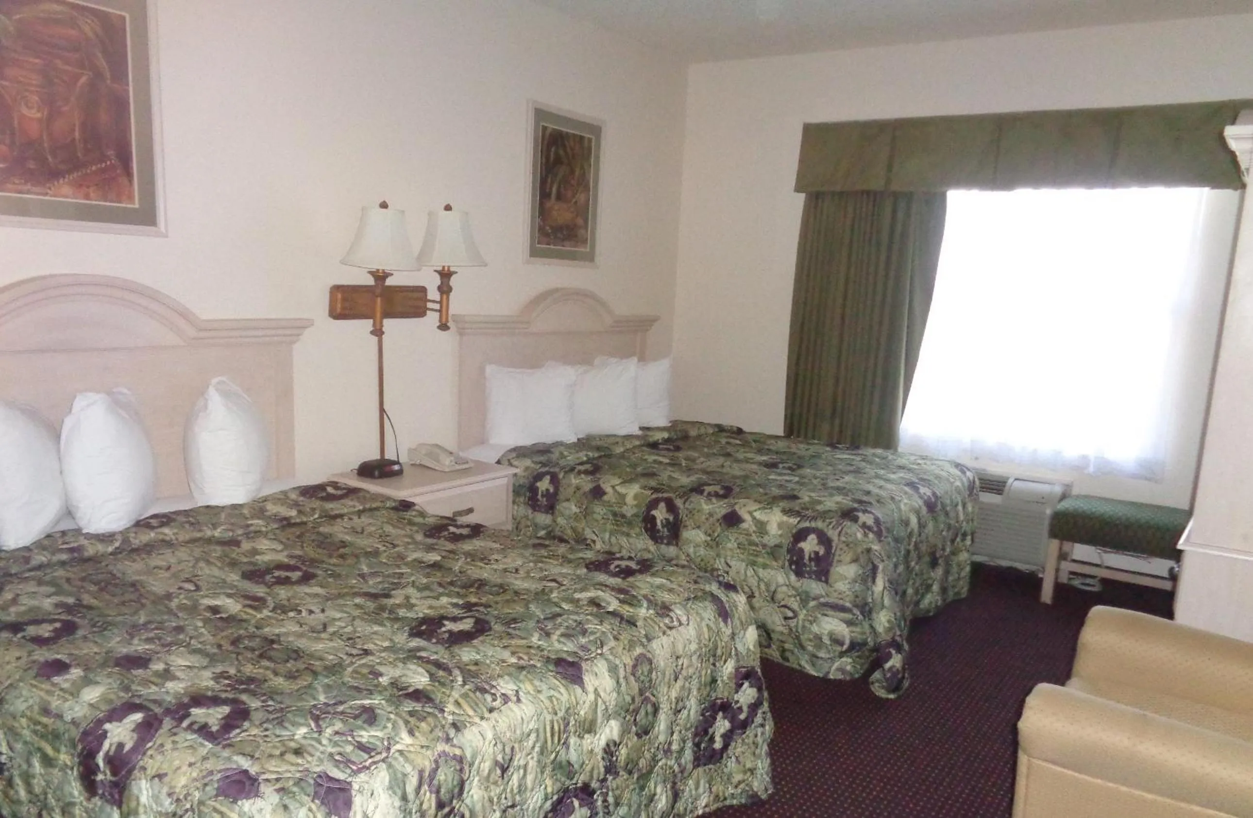 Bed in Allure Suites of Fort Myers