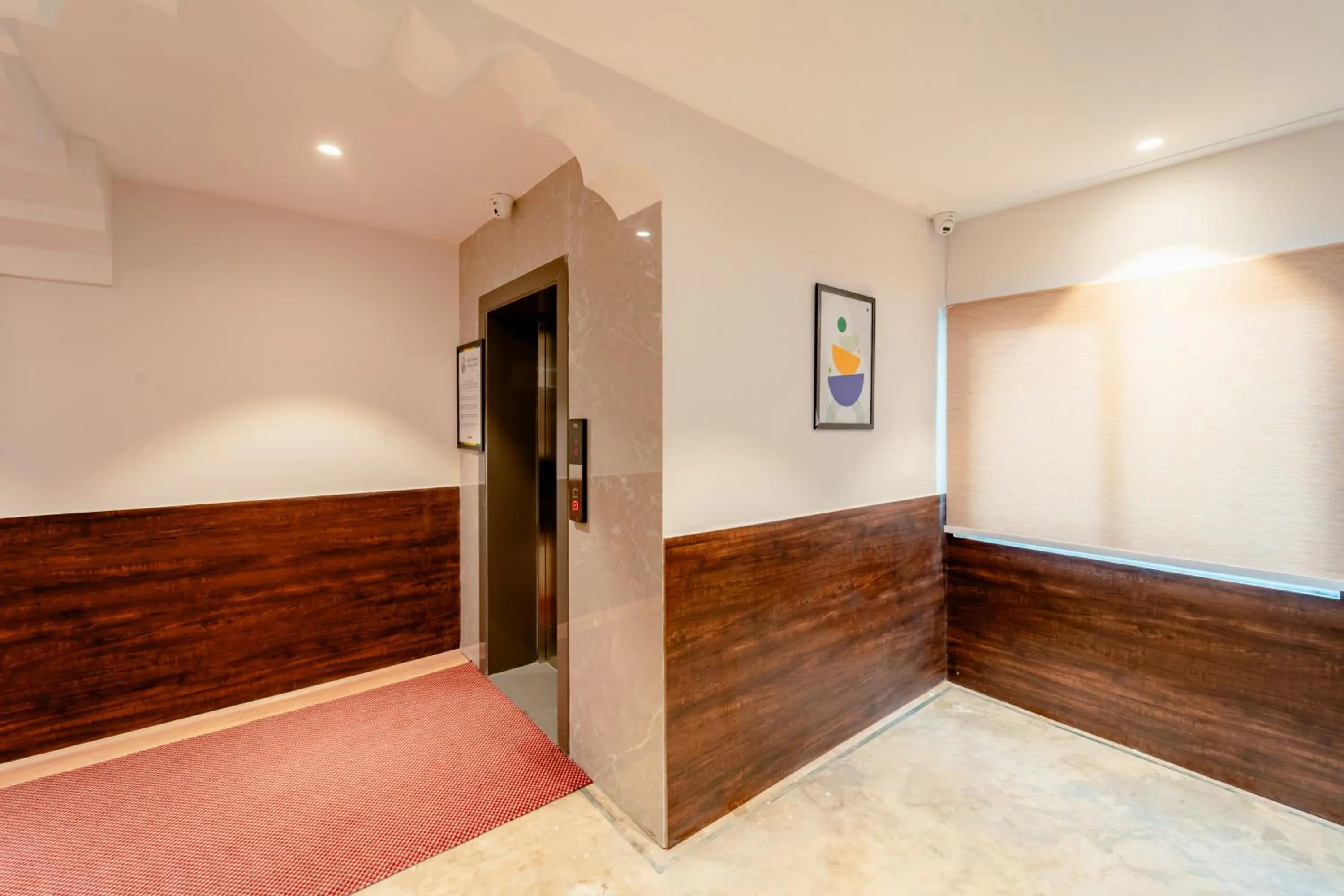 elevator, Bed in Treebo Premium Omni Residency
