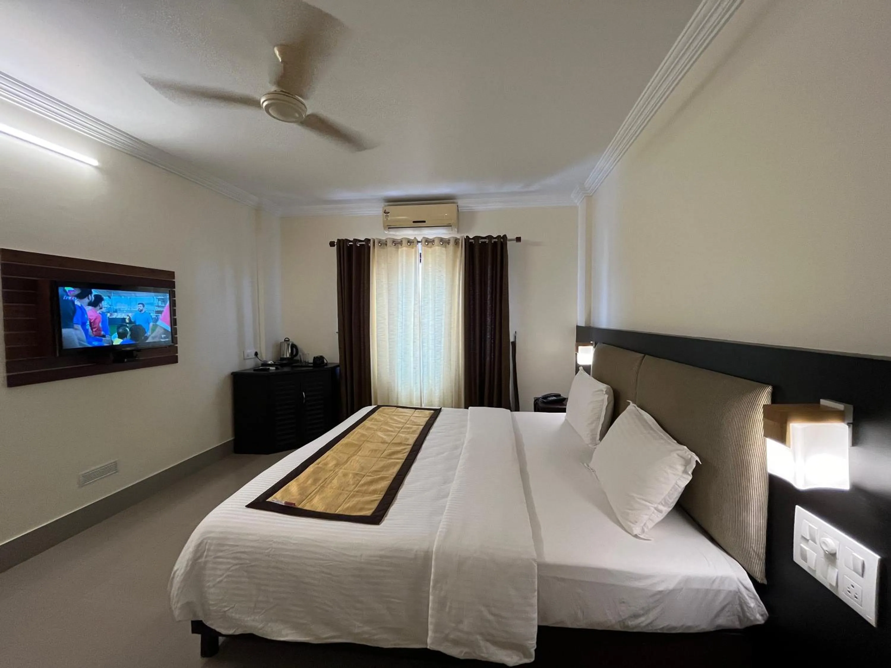 Bed in Malanadu Tourist Home