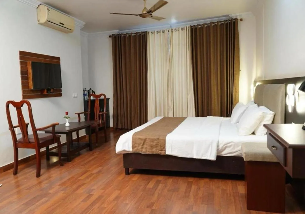 Bed in Malanadu Tourist Home