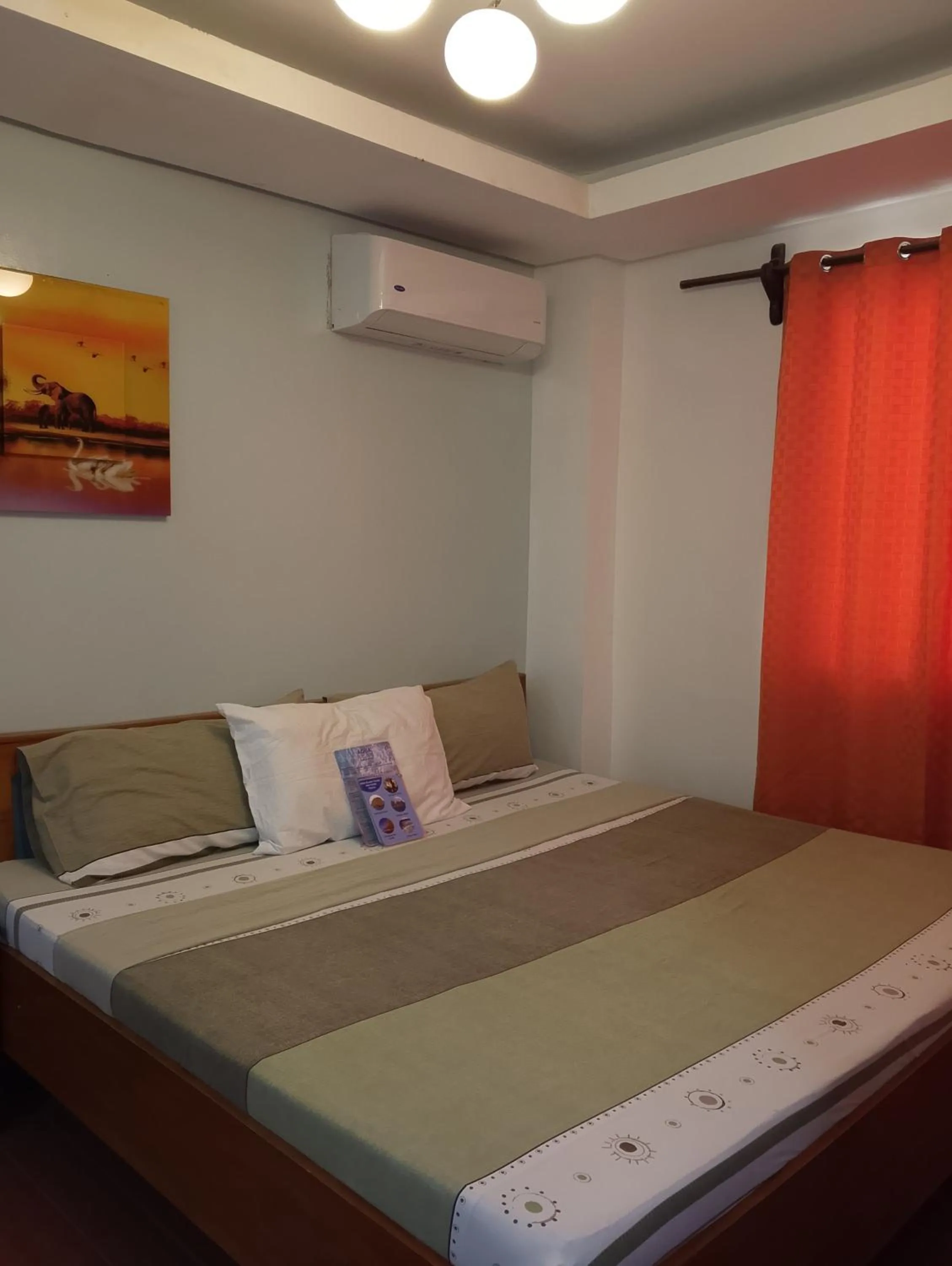 Bed in Aqua Travel Lodge