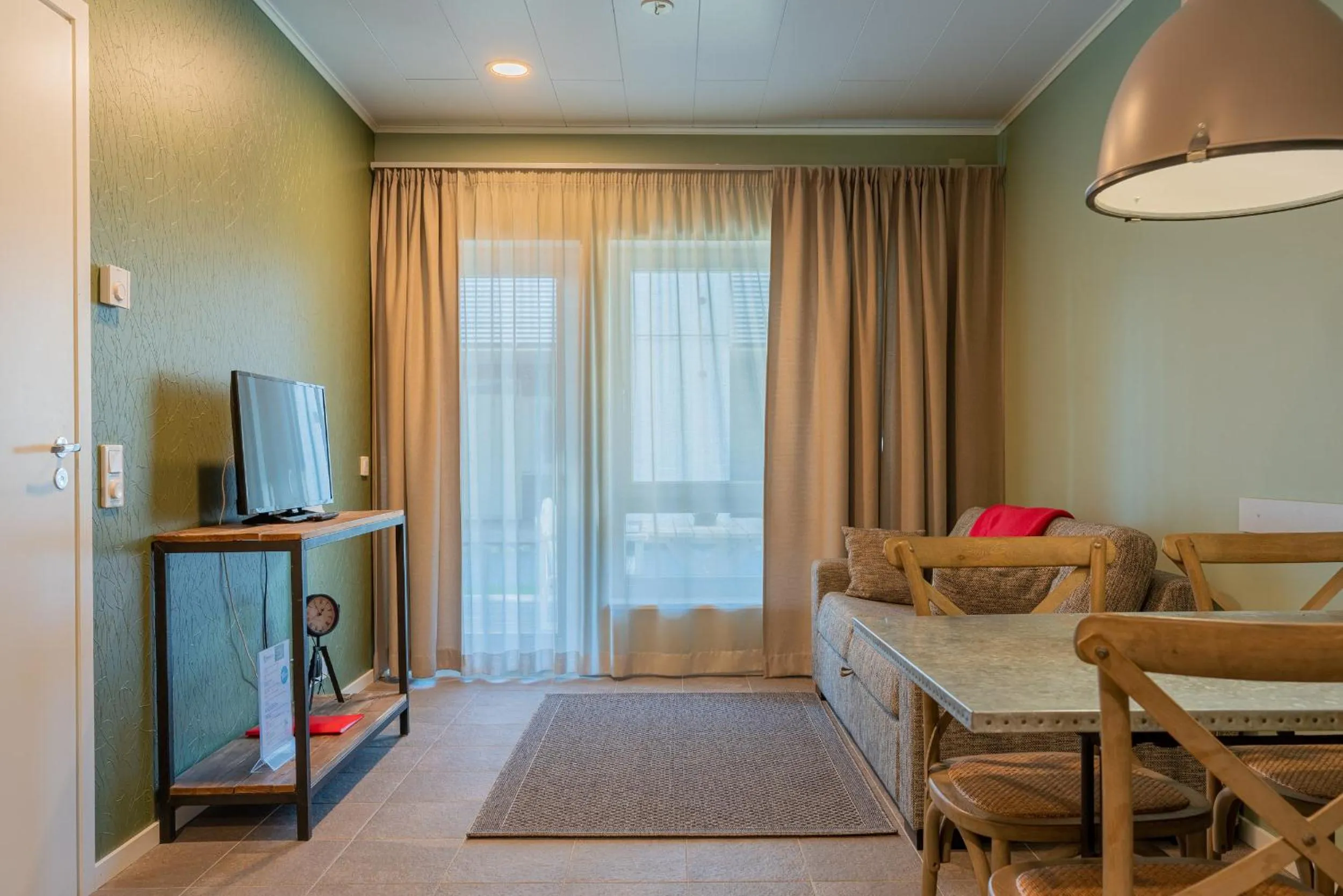 TV and multimedia, Bed in Saimaa Life Apartments