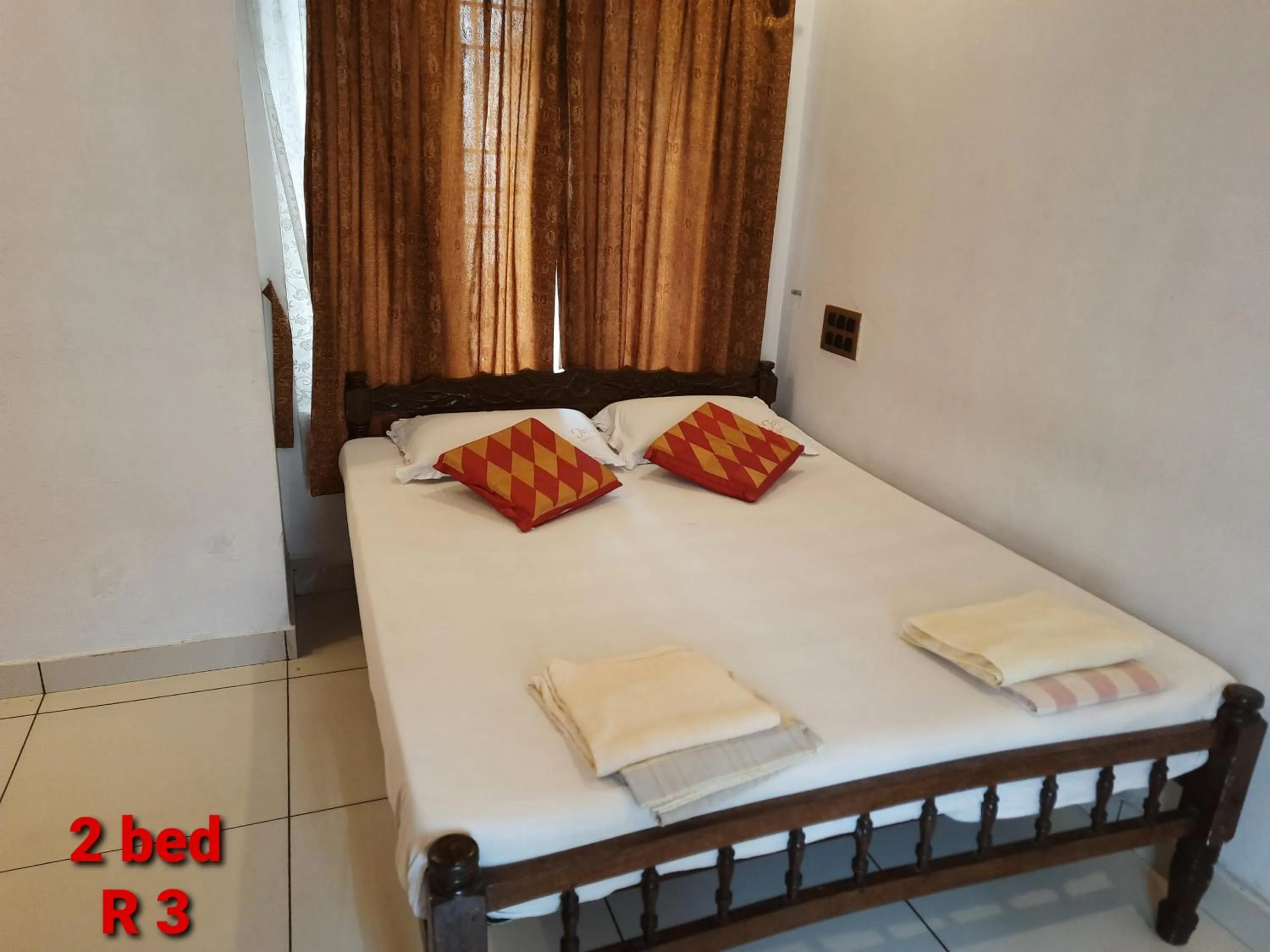 Bed in Jojies Homestay Fortkochi