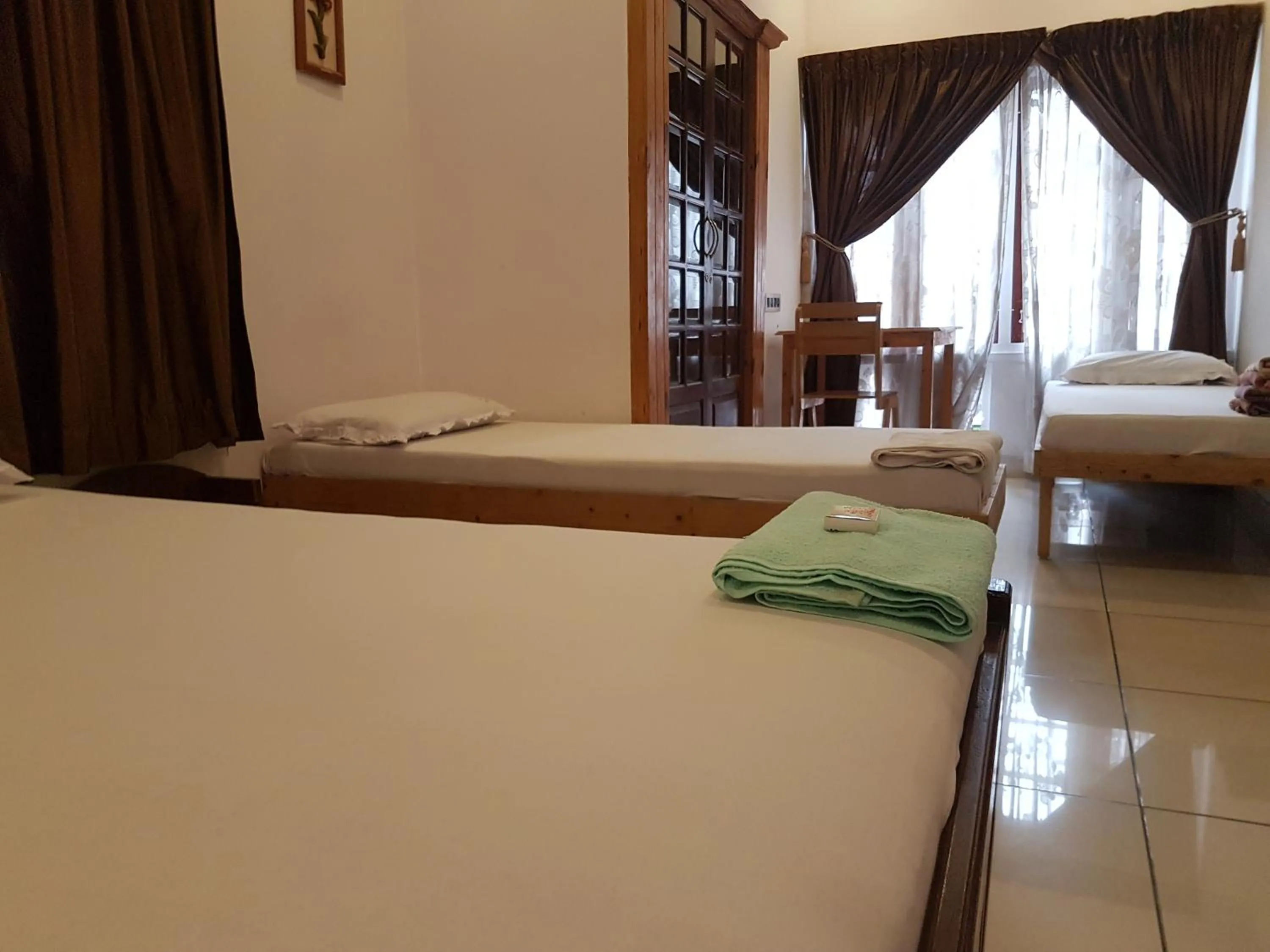Bed in Jojies Homestay Fortkochi