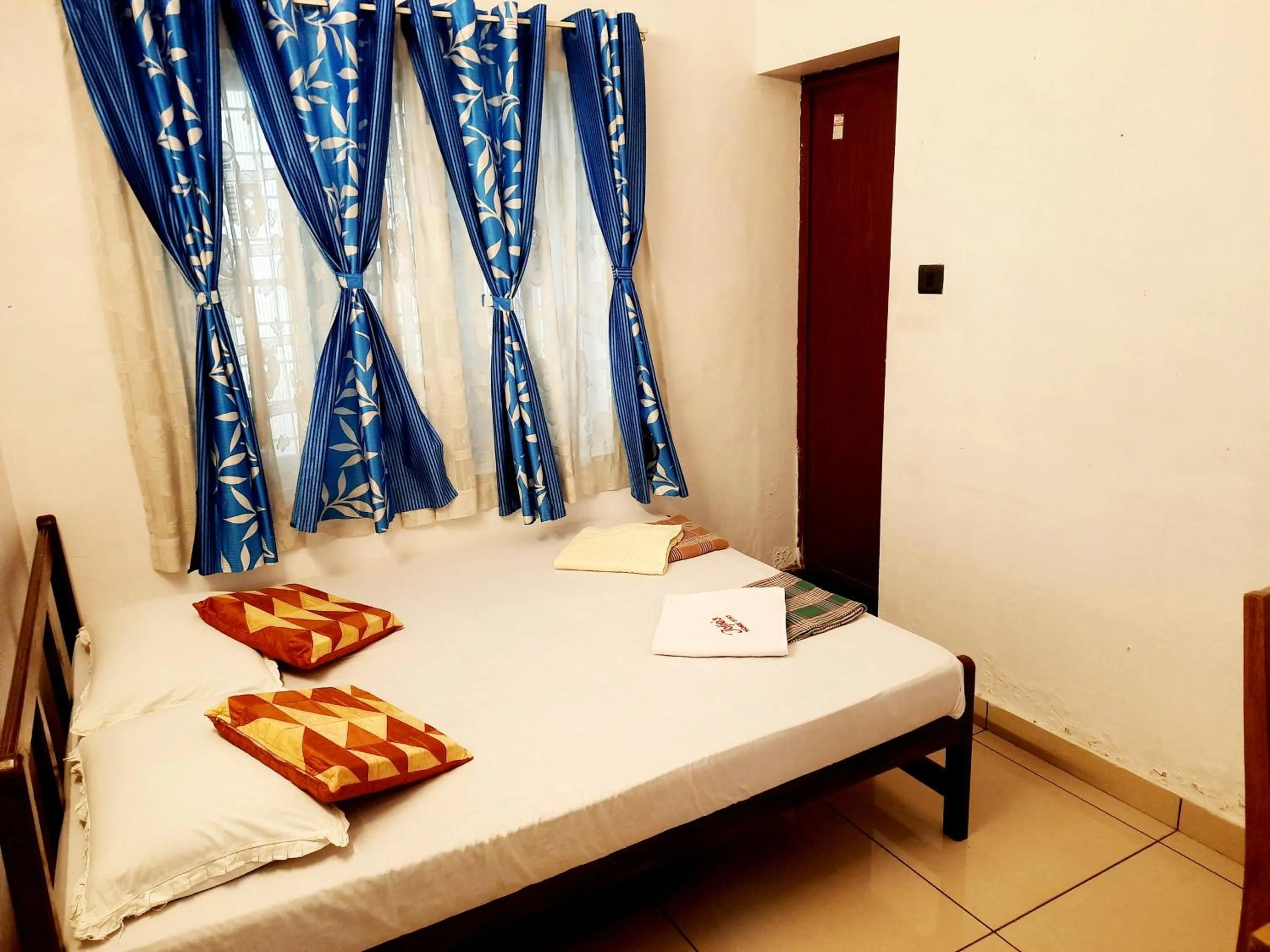 Bed in Jojies Homestay Fortkochi