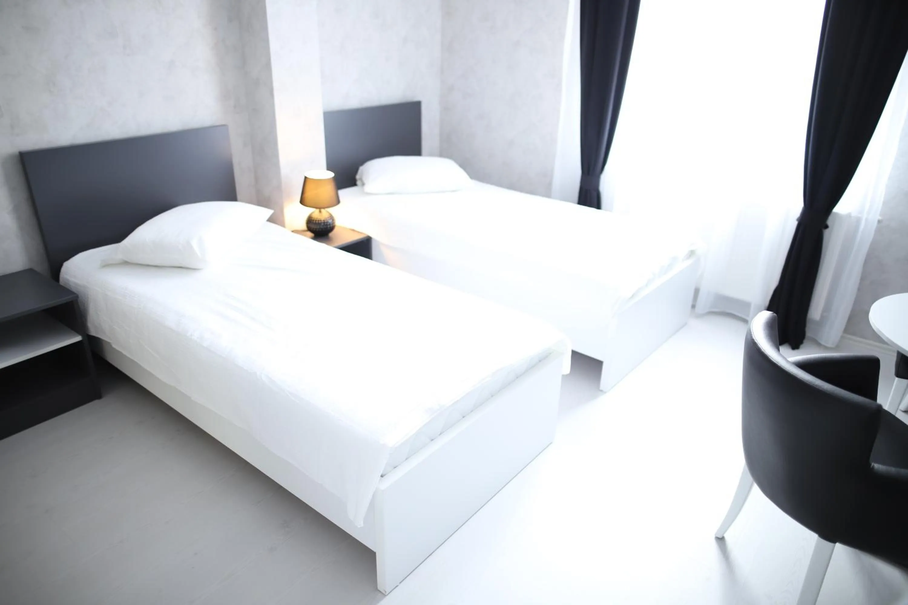 Bed in Hotel Antika