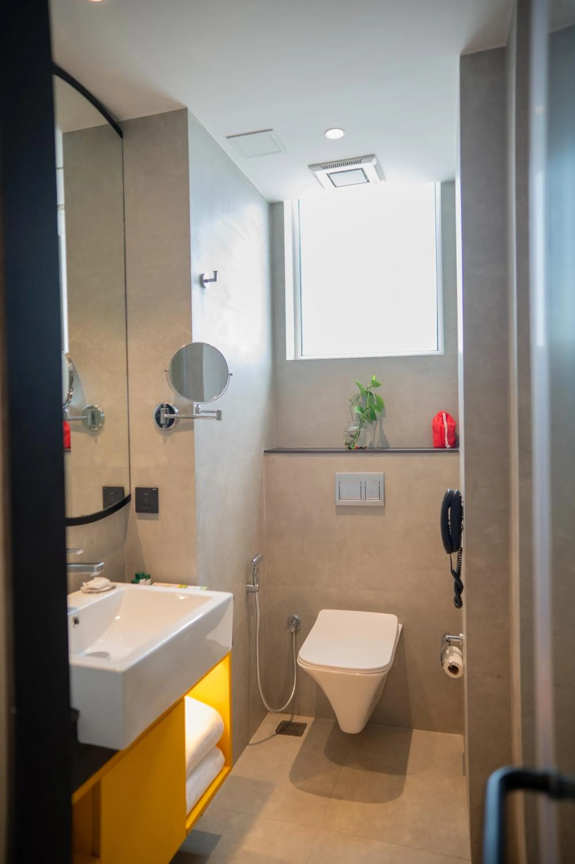 Bathroom in ZIBE Luxe Kakinada by GRT Hotels