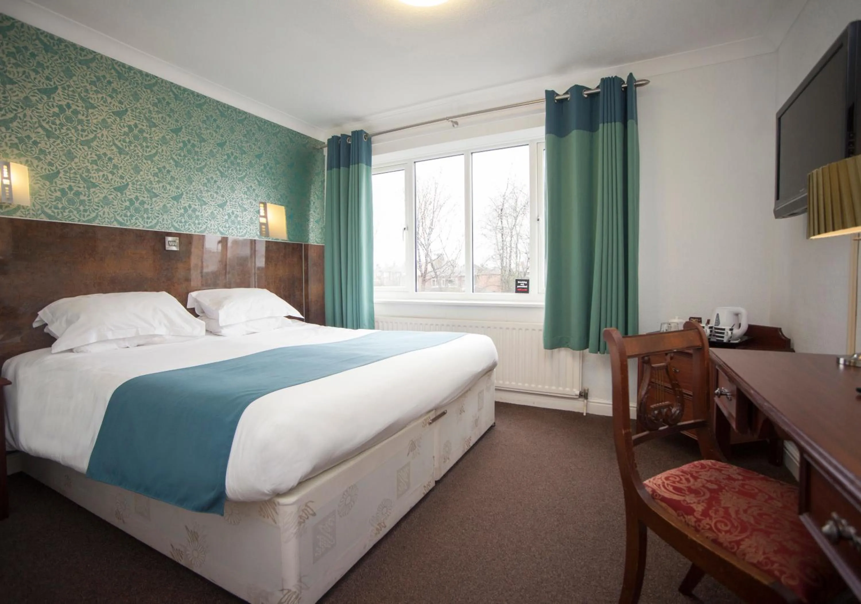 Bedroom in The Victoria Hotel Manchester by Compass Hospitality