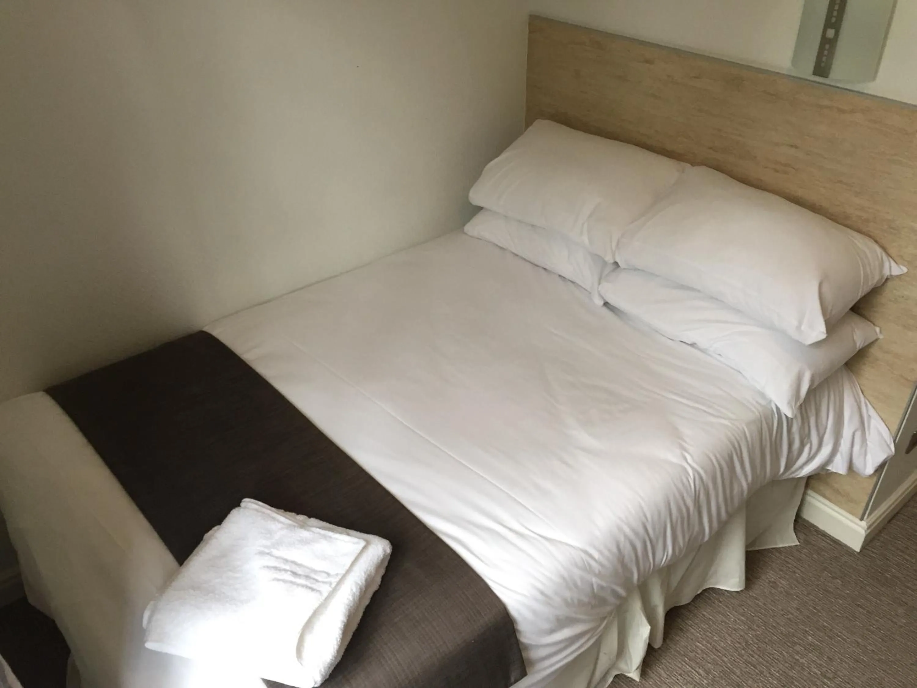 Bedroom in The Victoria Hotel Manchester by Compass Hospitality