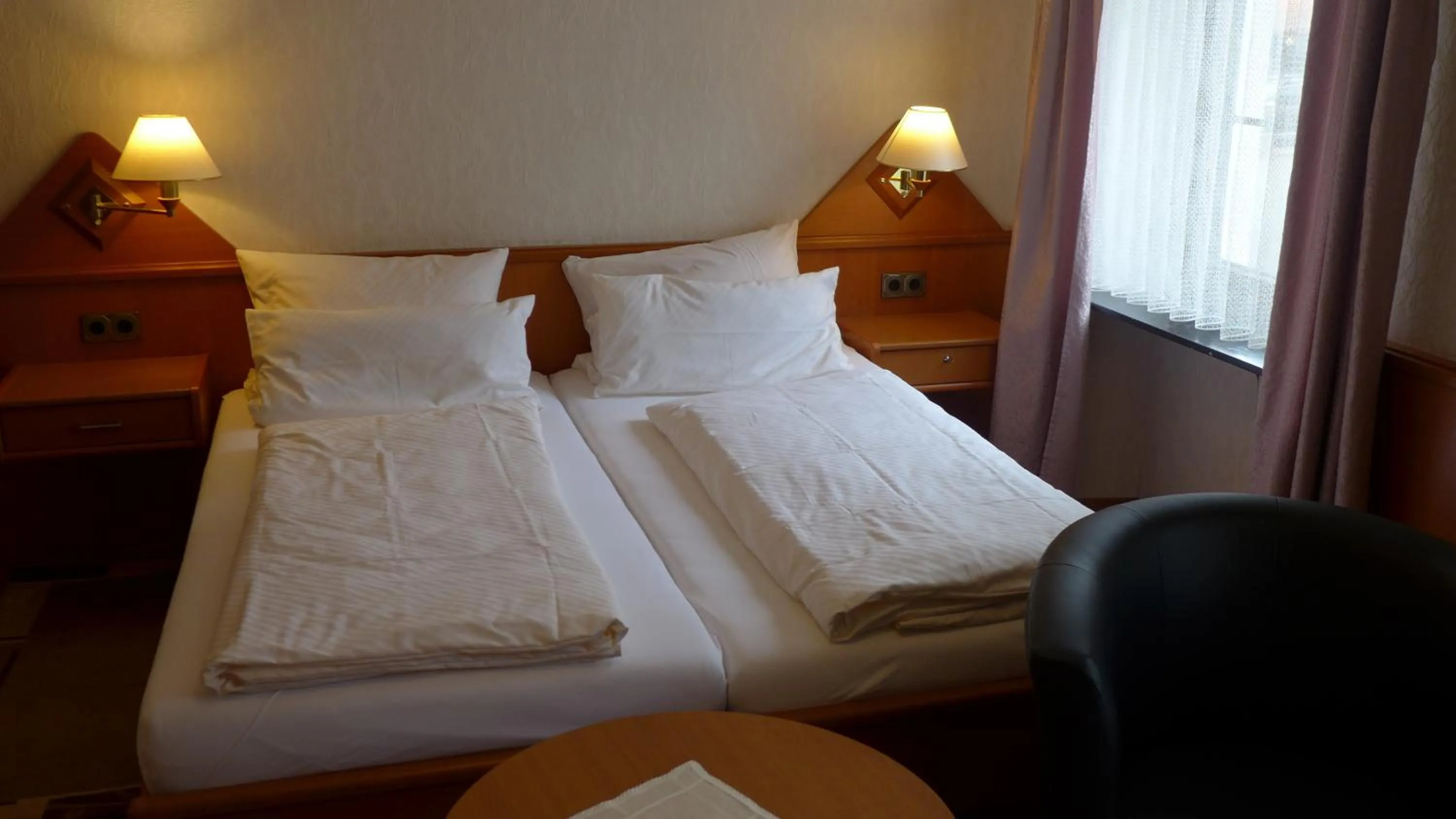 Bed in Central-Hotel Greiveldinger
