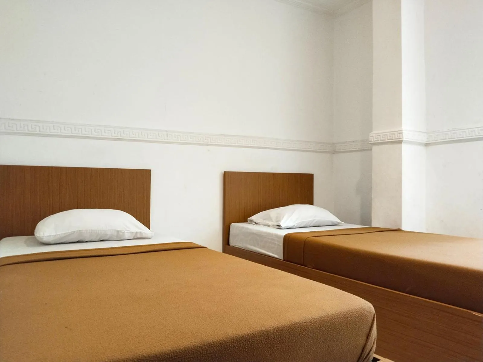 Bed in Wisma Juanda Powered by Cocotel