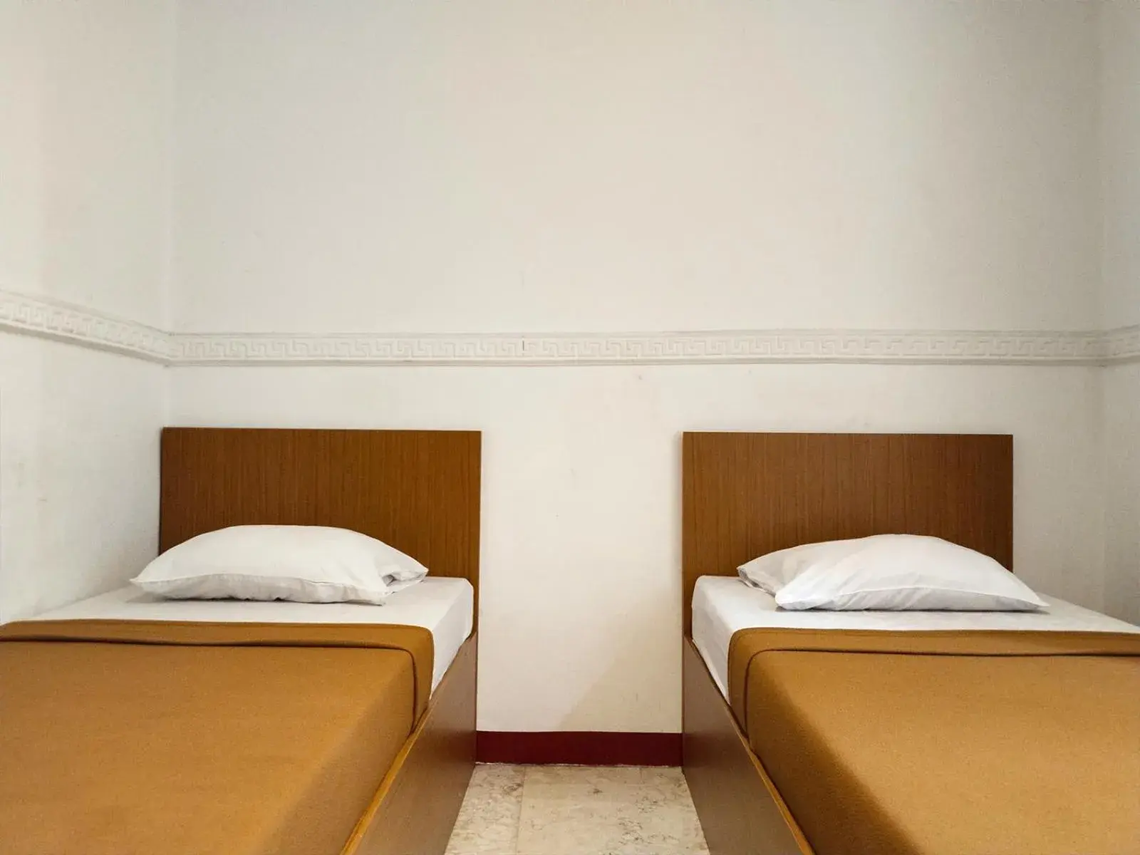 Bed in Wisma Juanda Powered by Cocotel Bed in Wisma Juanda Powered by Cocotel