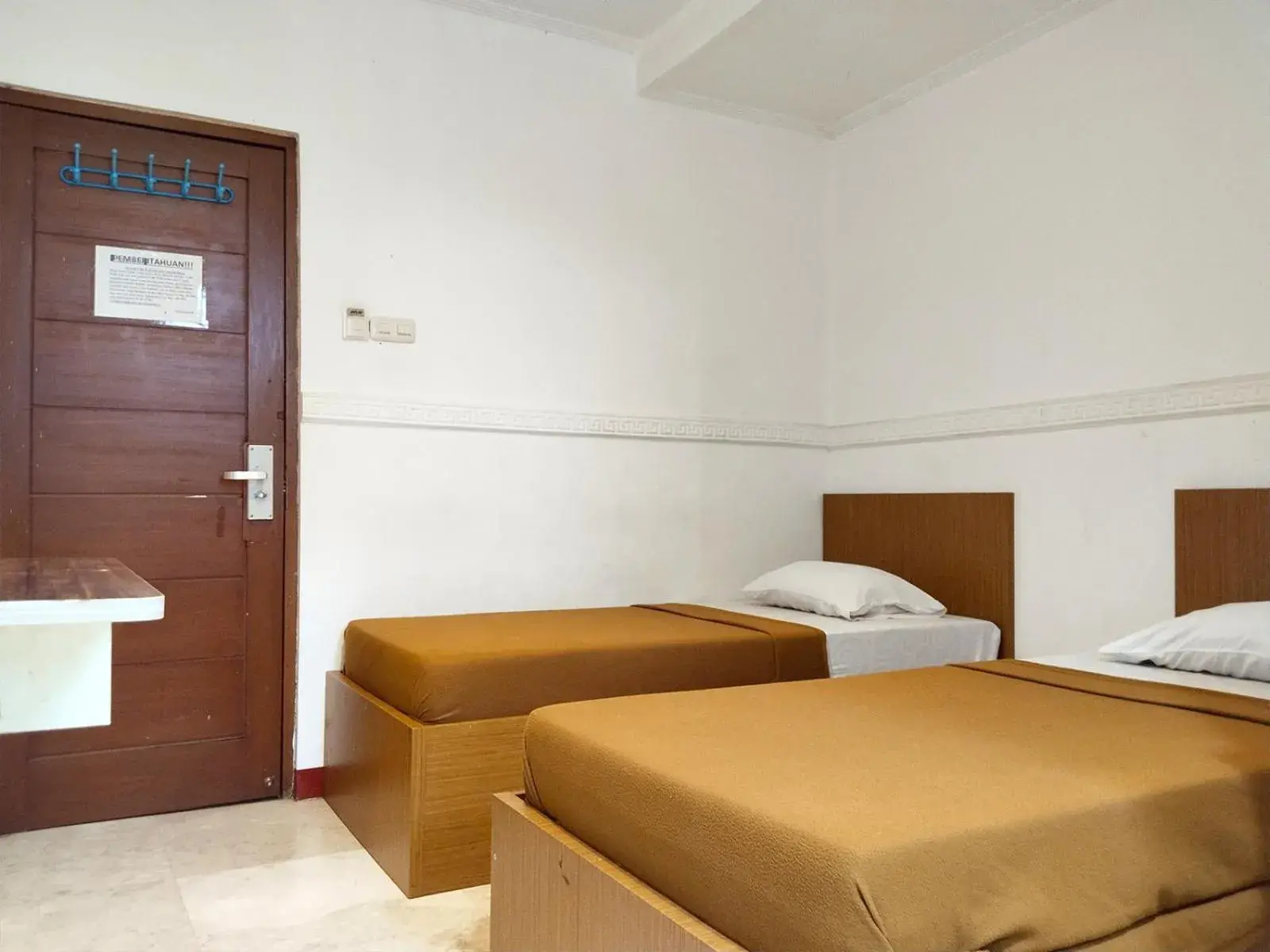 Bed in Wisma Juanda Powered by Cocotel Bed in Wisma Juanda Powered by Cocotel