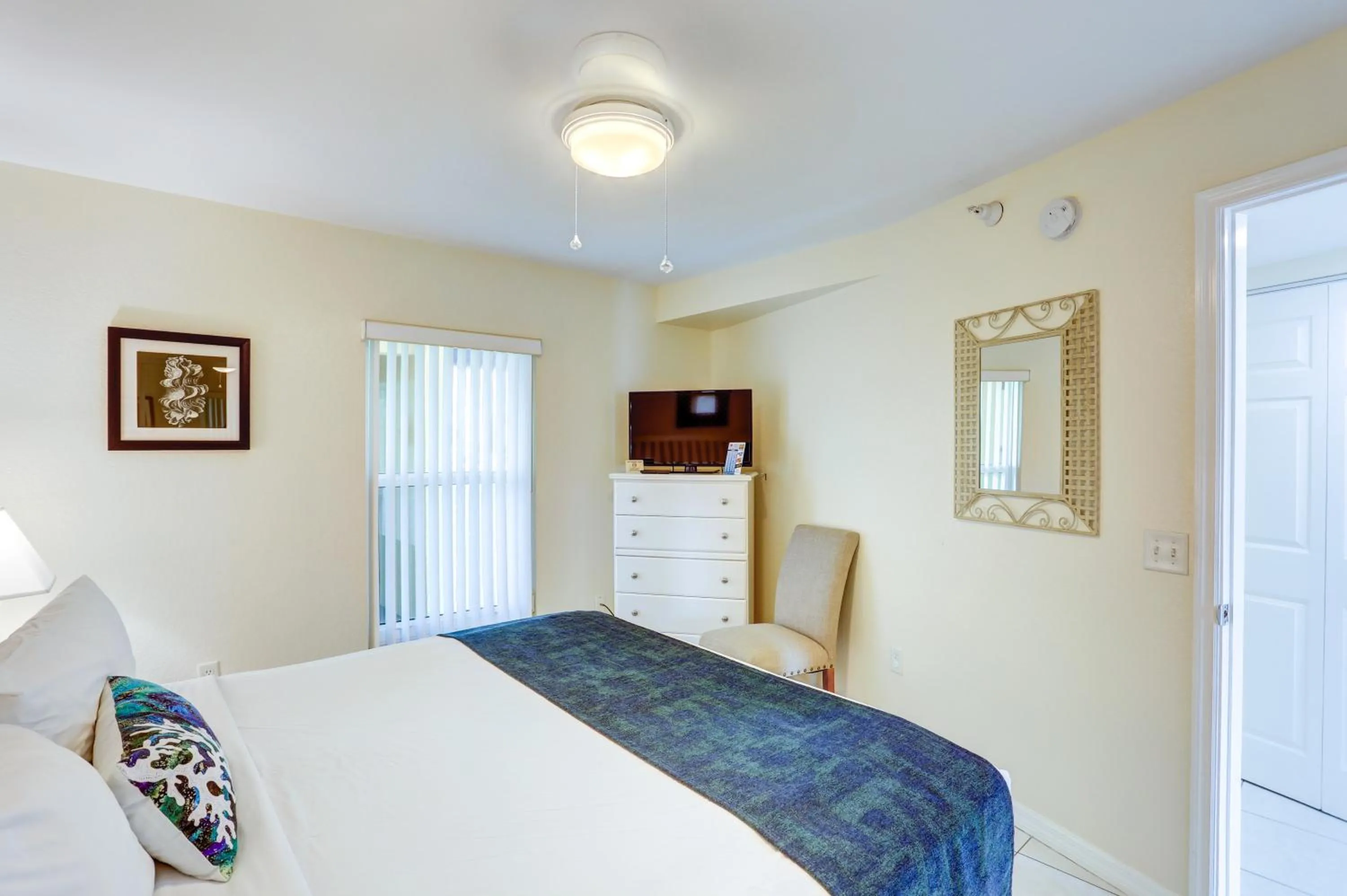 Bed in South Beach Condo Hotel by Travel Resort Services, Inc.