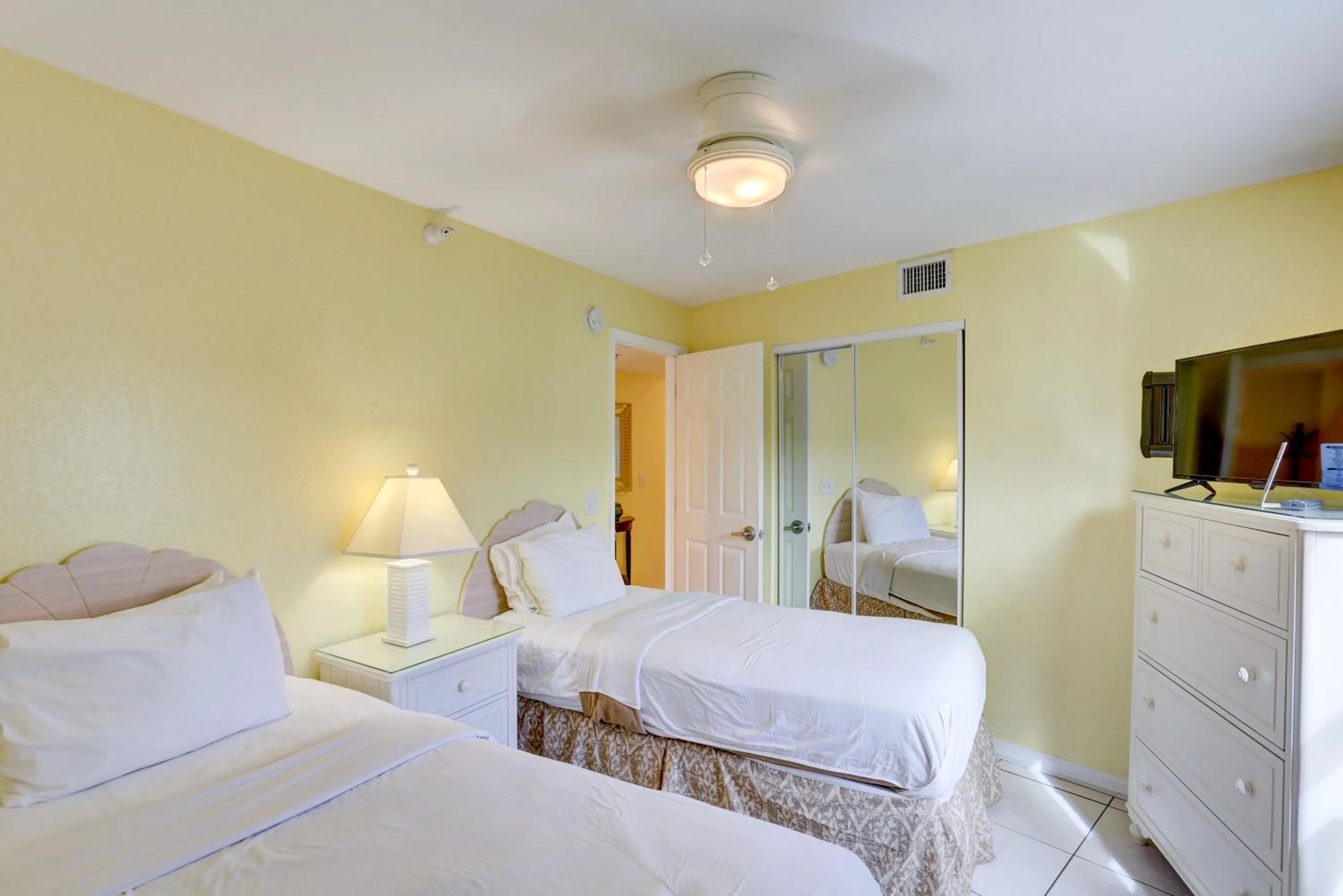 Bed in South Beach Condo Hotel by Travel Resort Services, Inc.