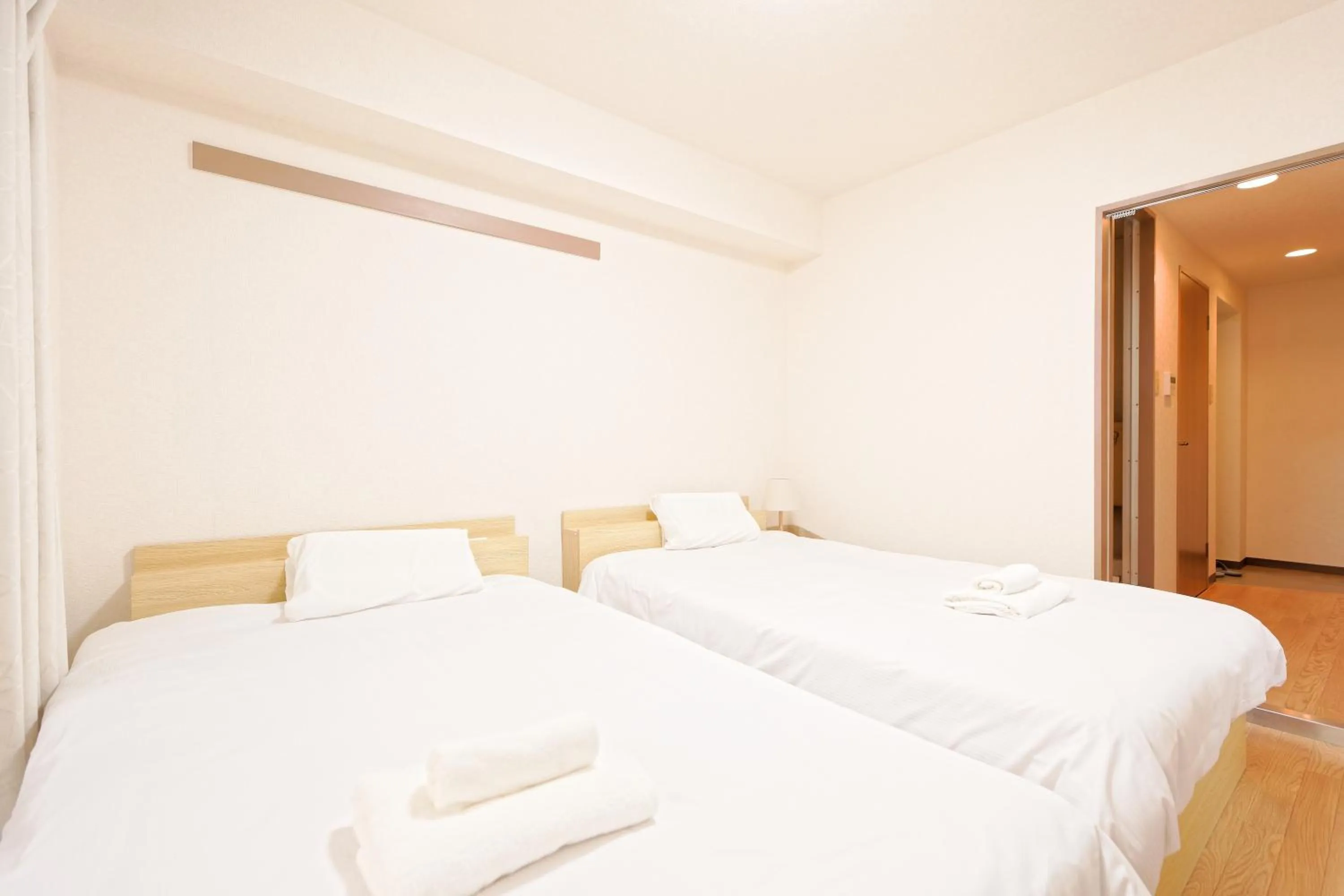 Bed in Shinjuku Waseda Earthtone Apartment