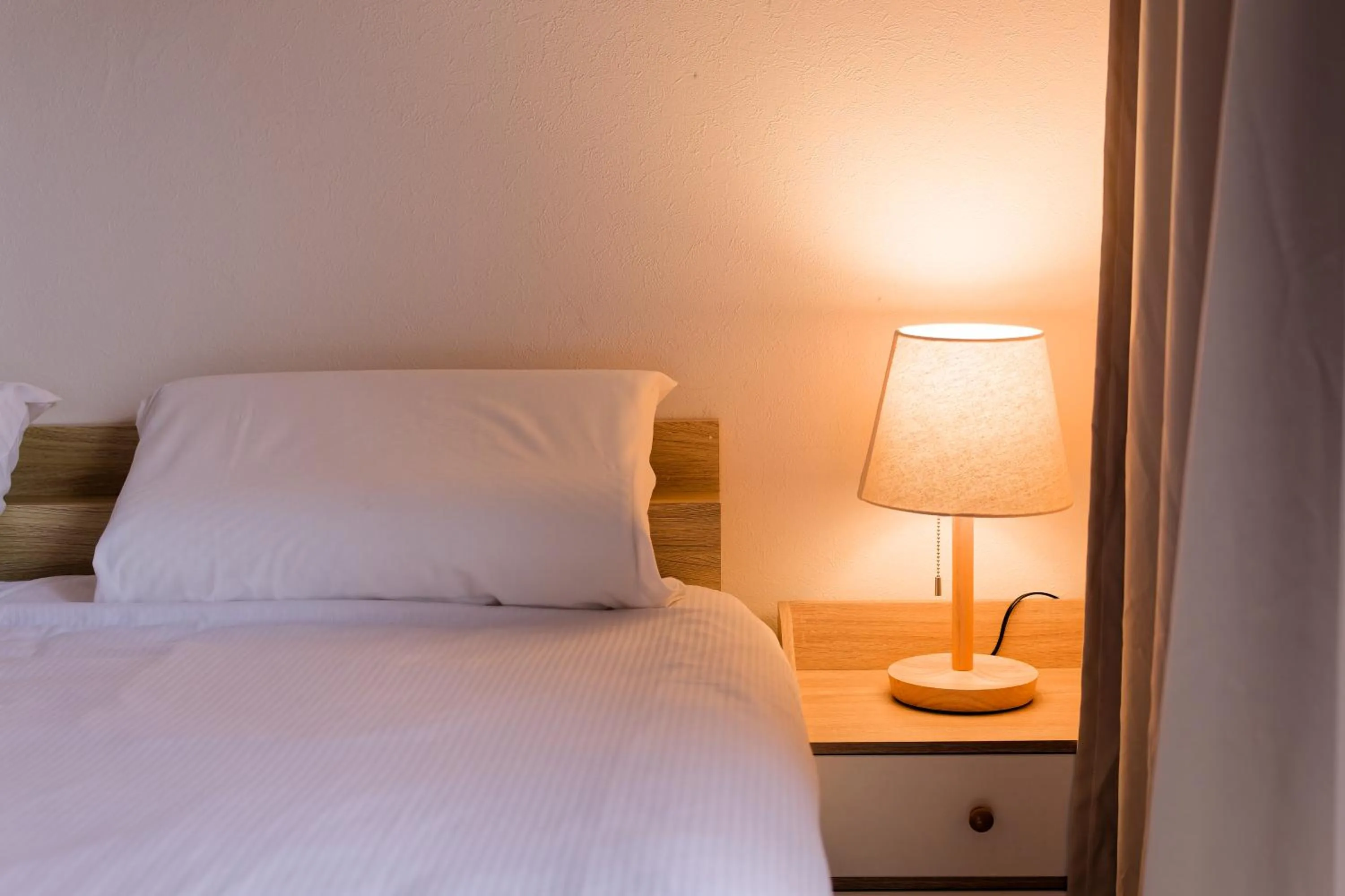 Bed in Shinjuku Waseda Earthtone Apartment