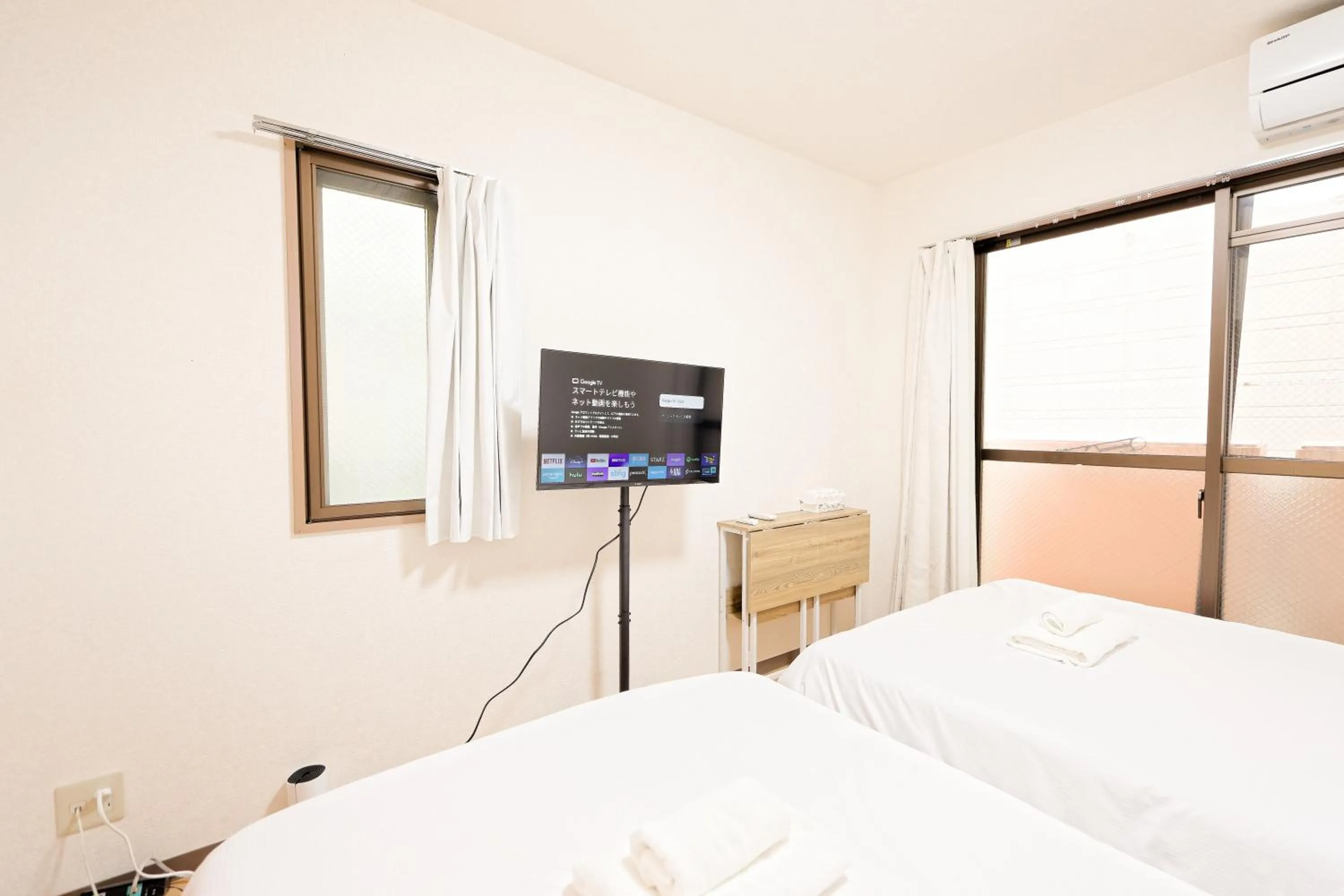 Bed in Shinjuku Waseda Earthtone Apartment