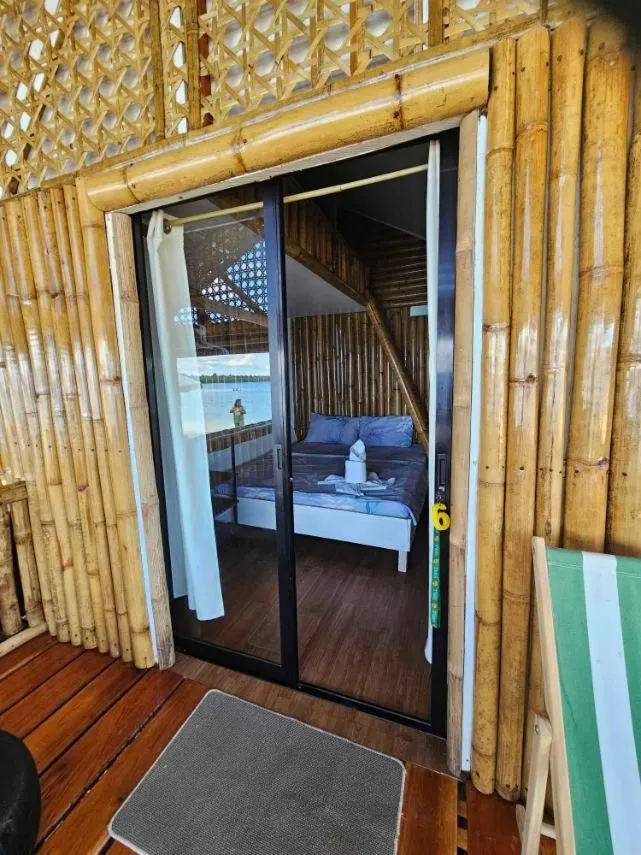 View (from property/room), Bed in Tambayan Rooms and Cottages by SMS Hospitality
