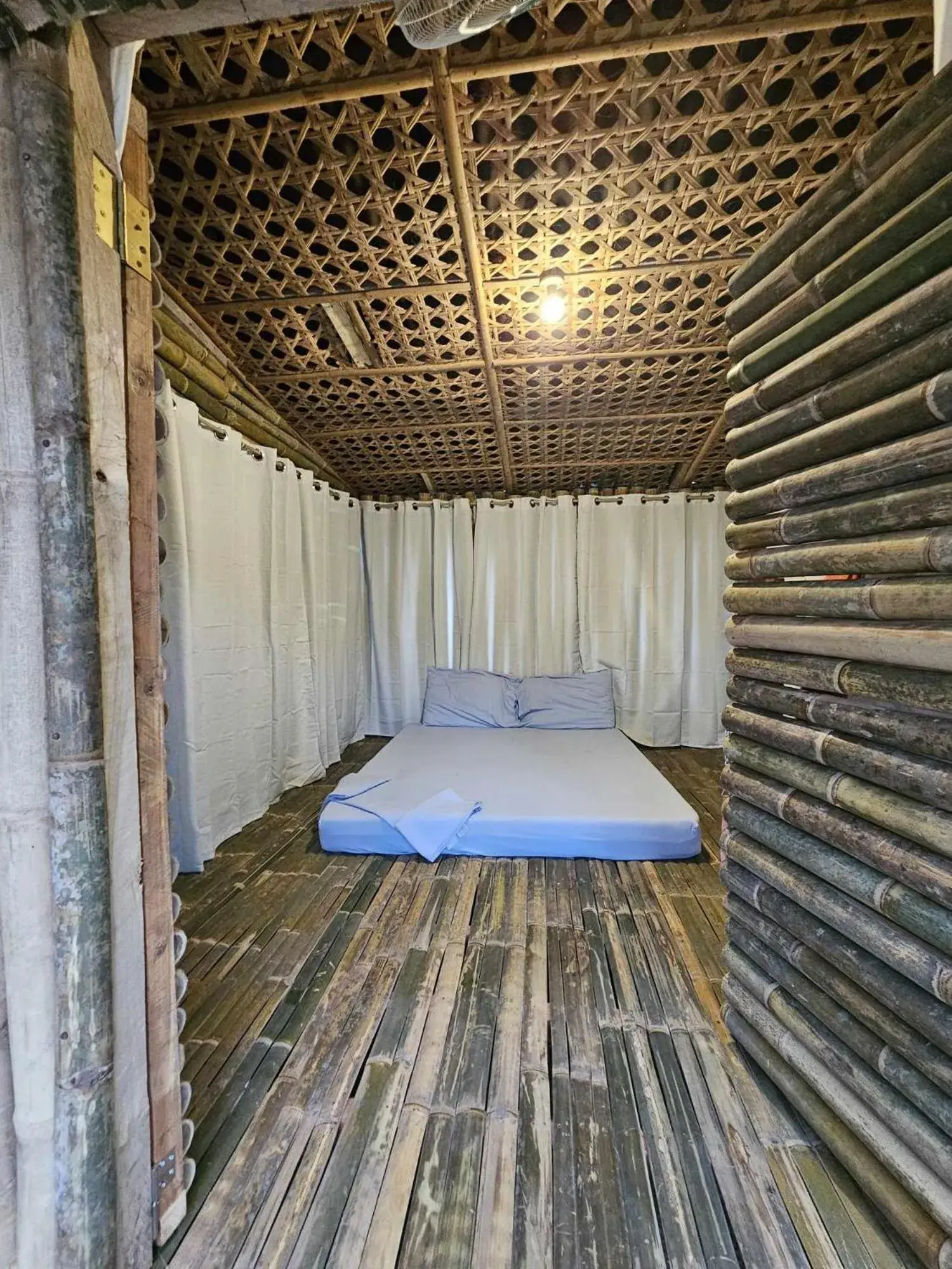 Bed in Tambayan Rooms and Cottages by SMS Hospitality Bed in Tambayan Rooms and Cottages by SMS Hospitality