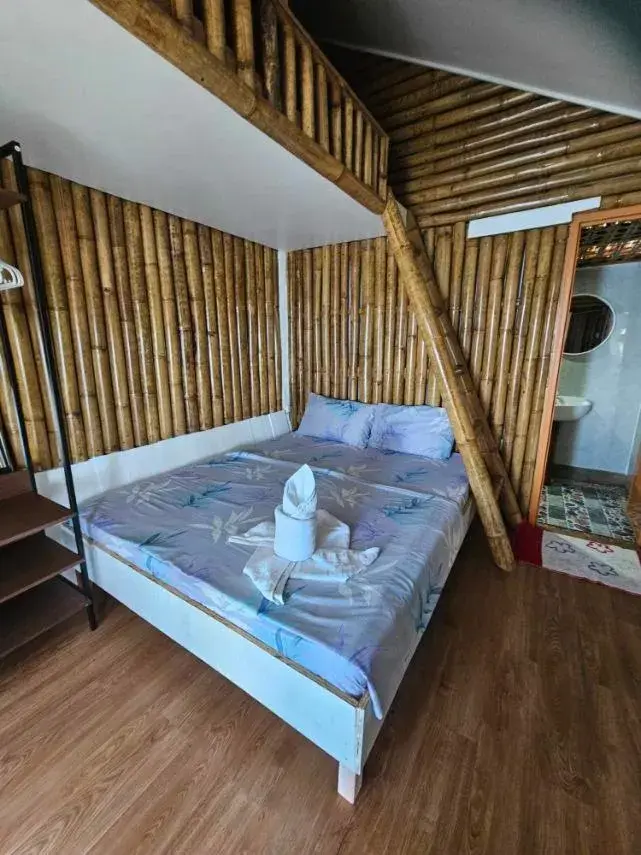 Bed in Tambayan Rooms and Cottages by SMS Hospitality Bed in Tambayan Rooms and Cottages by SMS Hospitality