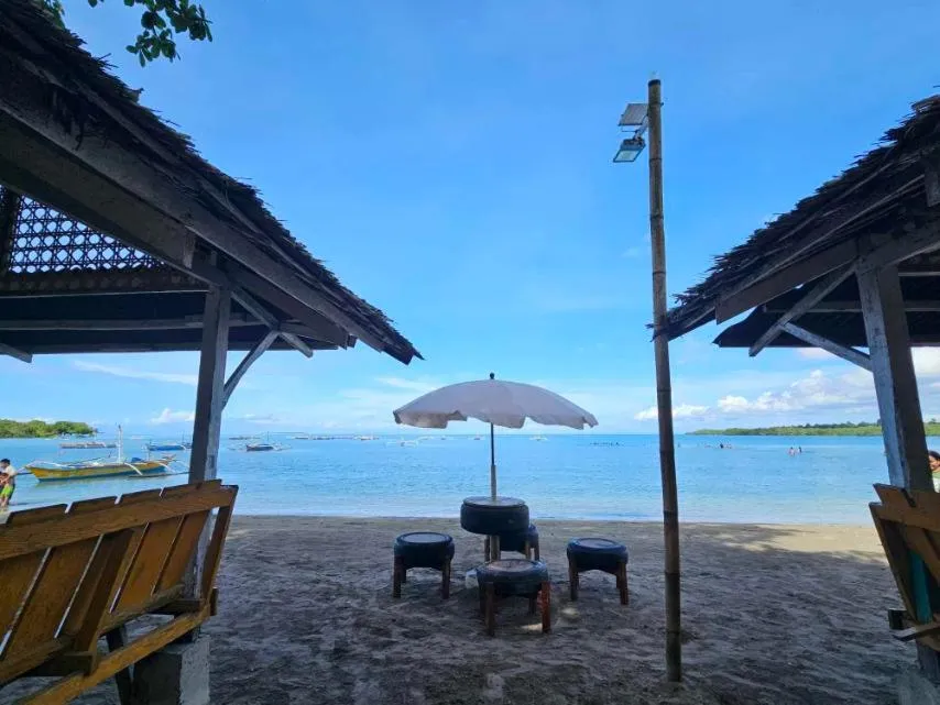 Beach in Tambayan Rooms and Cottages by SMS Hospitality