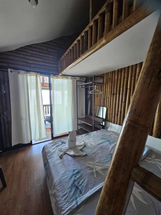 Bed in Tambayan Rooms and Cottages by SMS Hospitality